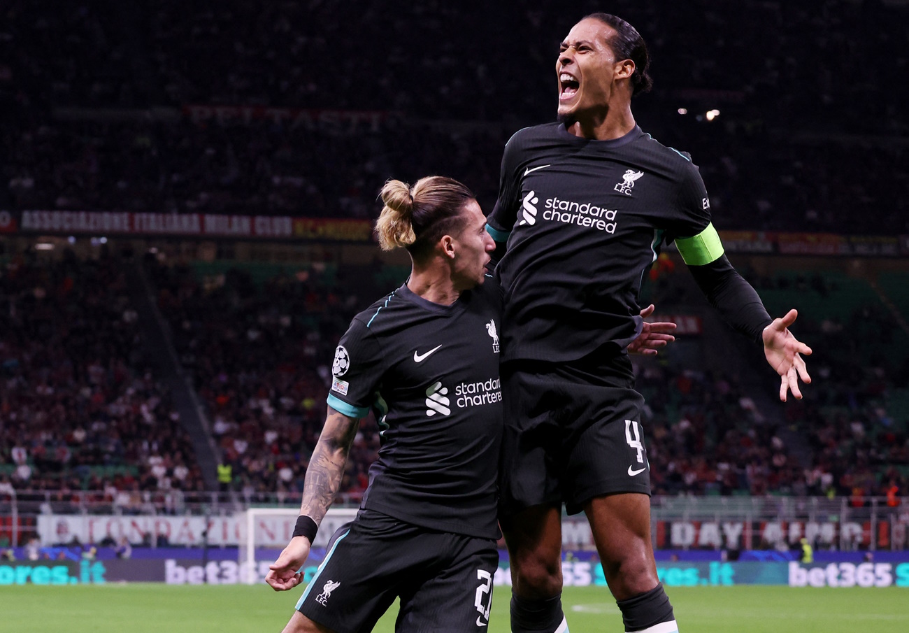 Soccer Football - Champions League - AC Milan v Liverpool - San Siro, Milan, Italy - September 17, 2024 Liverpool's Virgil van Dijk celebrates scoring their second goal with Kostas Tsimikas REUTERS