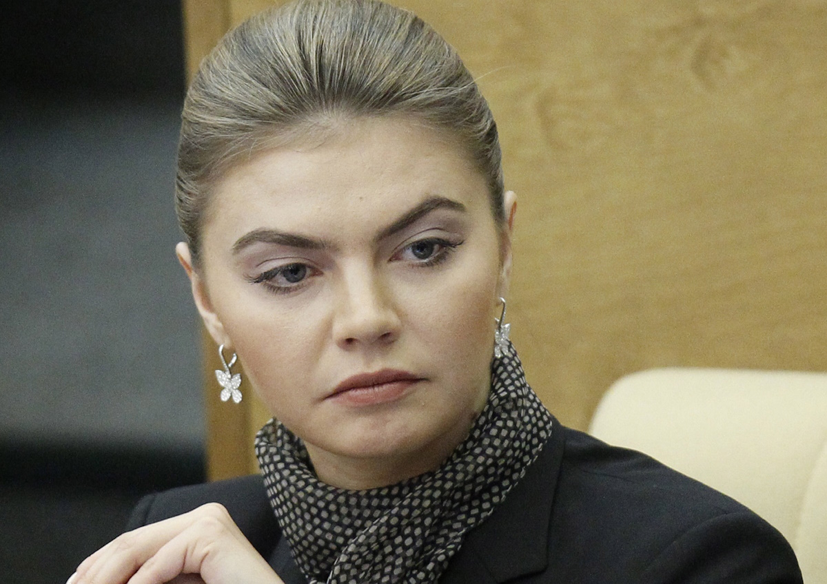 Alina Kabayeva, a former champion rhythmic gymnast and now a Duma member for the pro-Kremlin United Russia party, attends the first plenary session of the newly-elected State Duma, the lower parliament chamber, Moscow, Russia, Friday, Jan. 13, 2012. (AP Photo