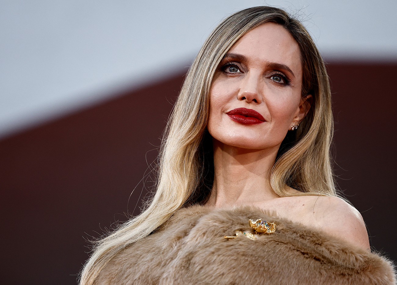Cast member Angelina Jolie poses on the red carpet during arrivals for the screening of the movie "Maria", in competition, at the 81st Venice Film Festival, Venice, Italy, August 29, 2024. REUTERS