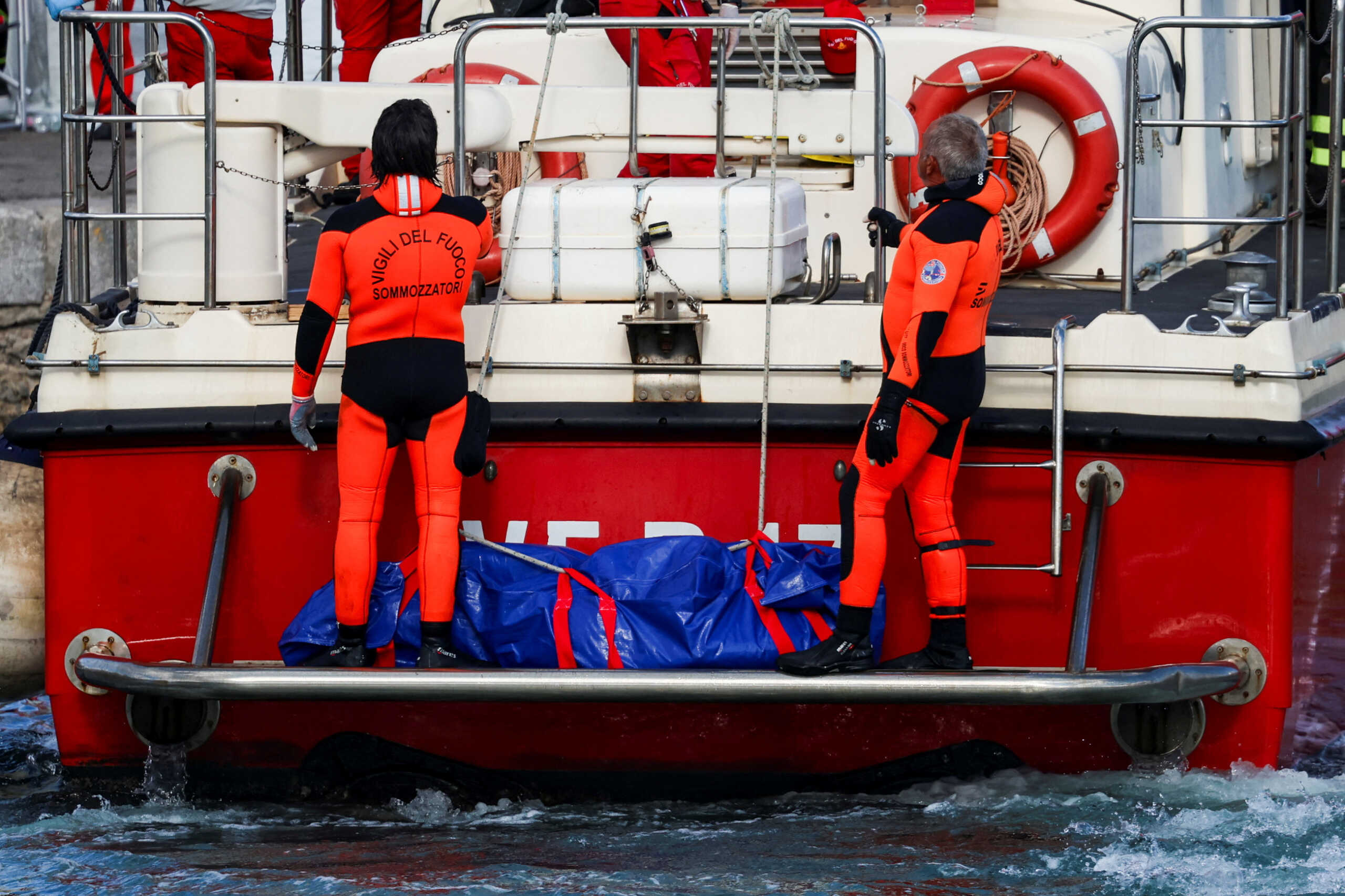 Rescue personnel transport a body bag after a luxury yacht, which was carrying British entrepreneur Mike Lynch, sank off the coast of Porticello, near the Sicilian city of Palermo, Italy, August 21, 2024. REUTERS
