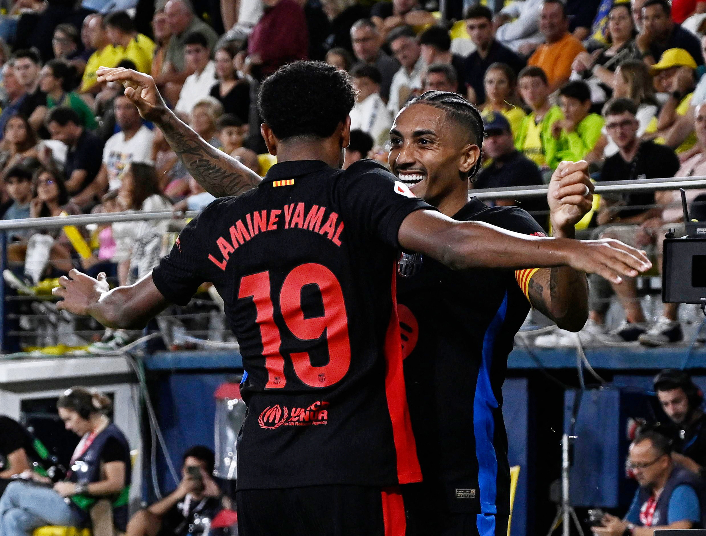 Soccer Football - LaLiga - Villarreal v FC Barcelona - Estadio de la Ceramica, Villarreal, Spain - September 22, 2024 FC Barcelona's Raphinha celebrates scoring their fifth goal with Lamine Yamal REUTERS