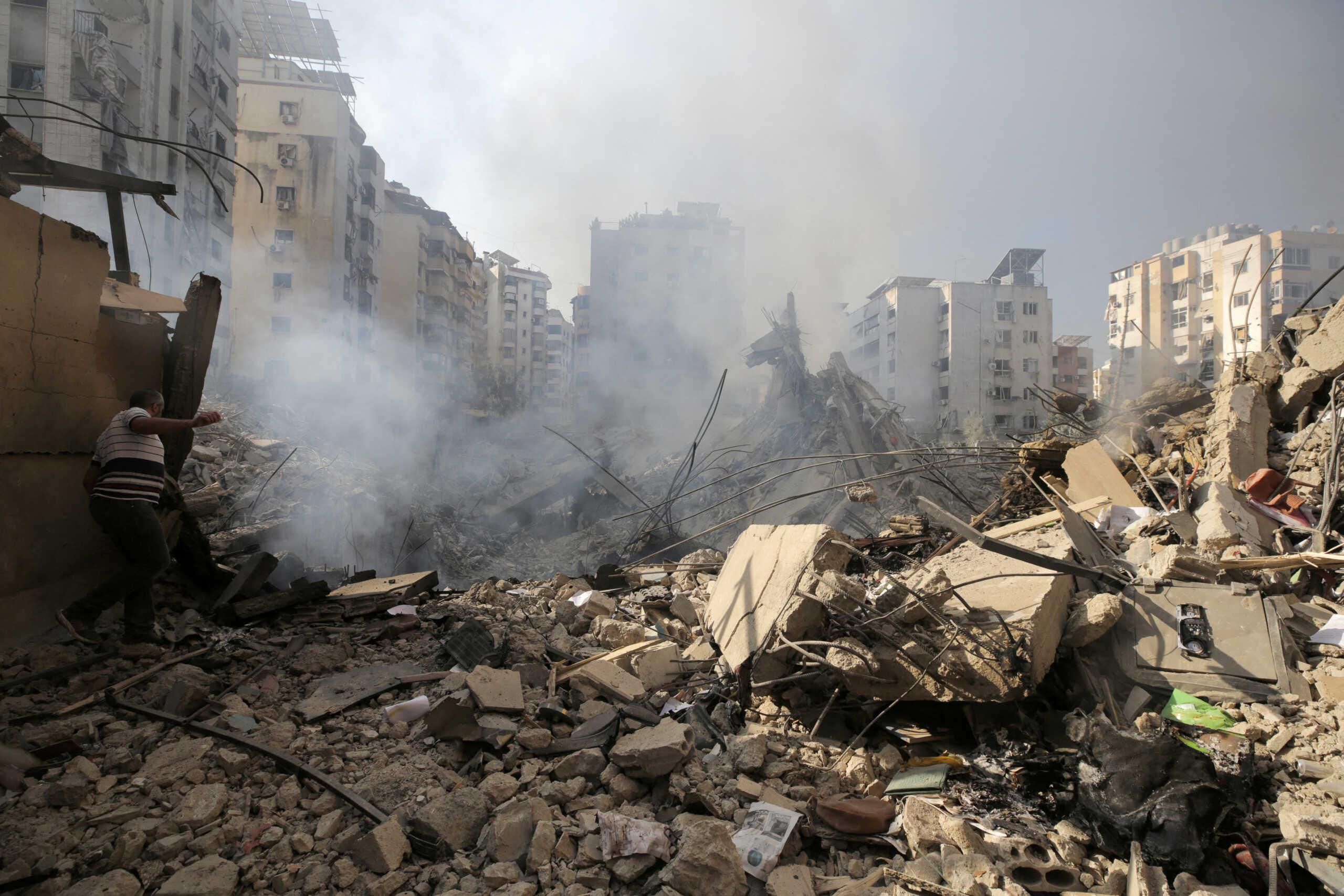 A man walks on the rubble of damaged buildings in the aftermath of Israeli air strikes on Beirut's southern suburbs, Lebanon September 28, 2024. REUTERS