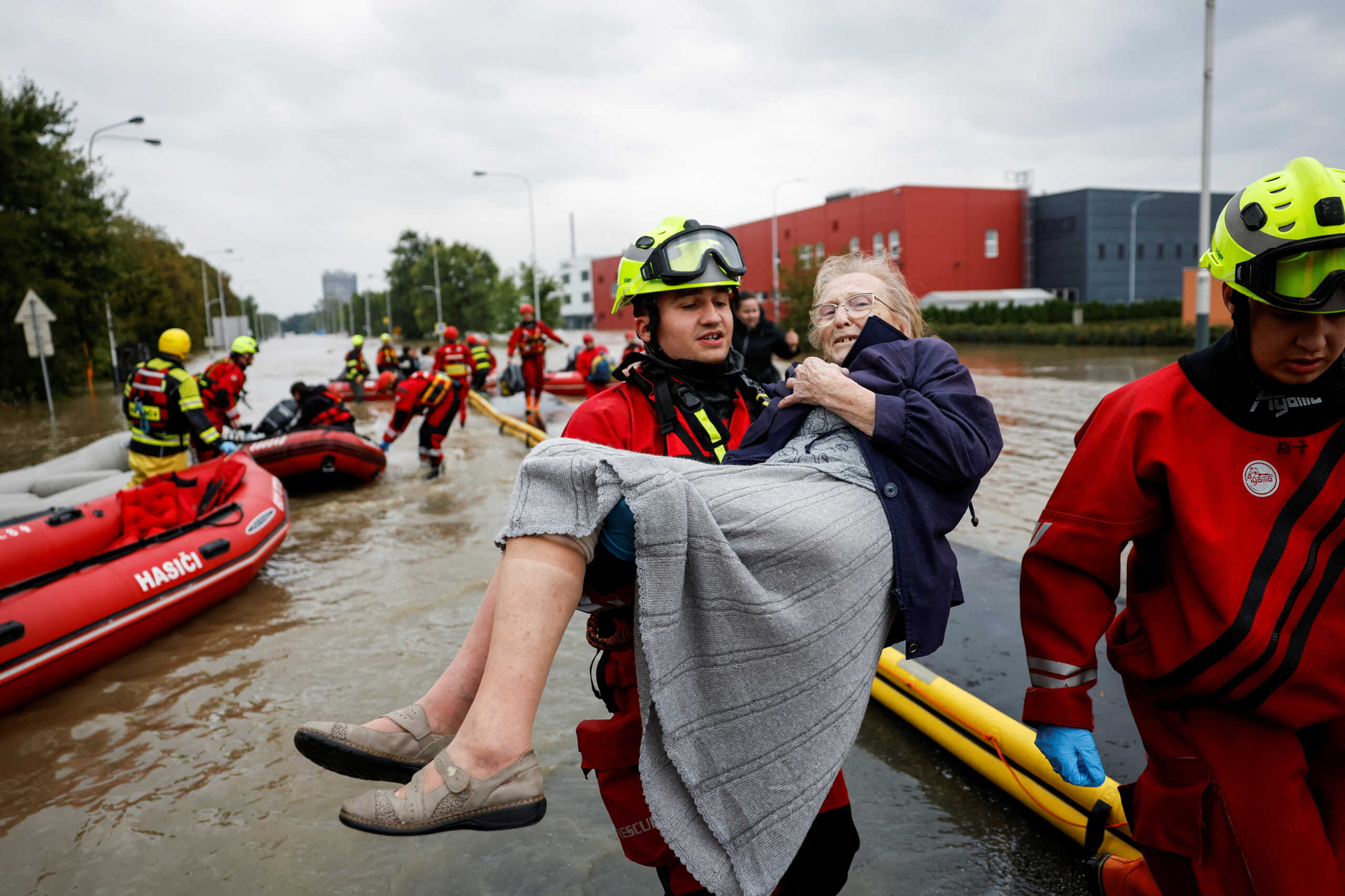 A rescue worker carries a woman, following heavy rainfalls in Ostrava, Czech Republic, September 16, 2024. REUTERS