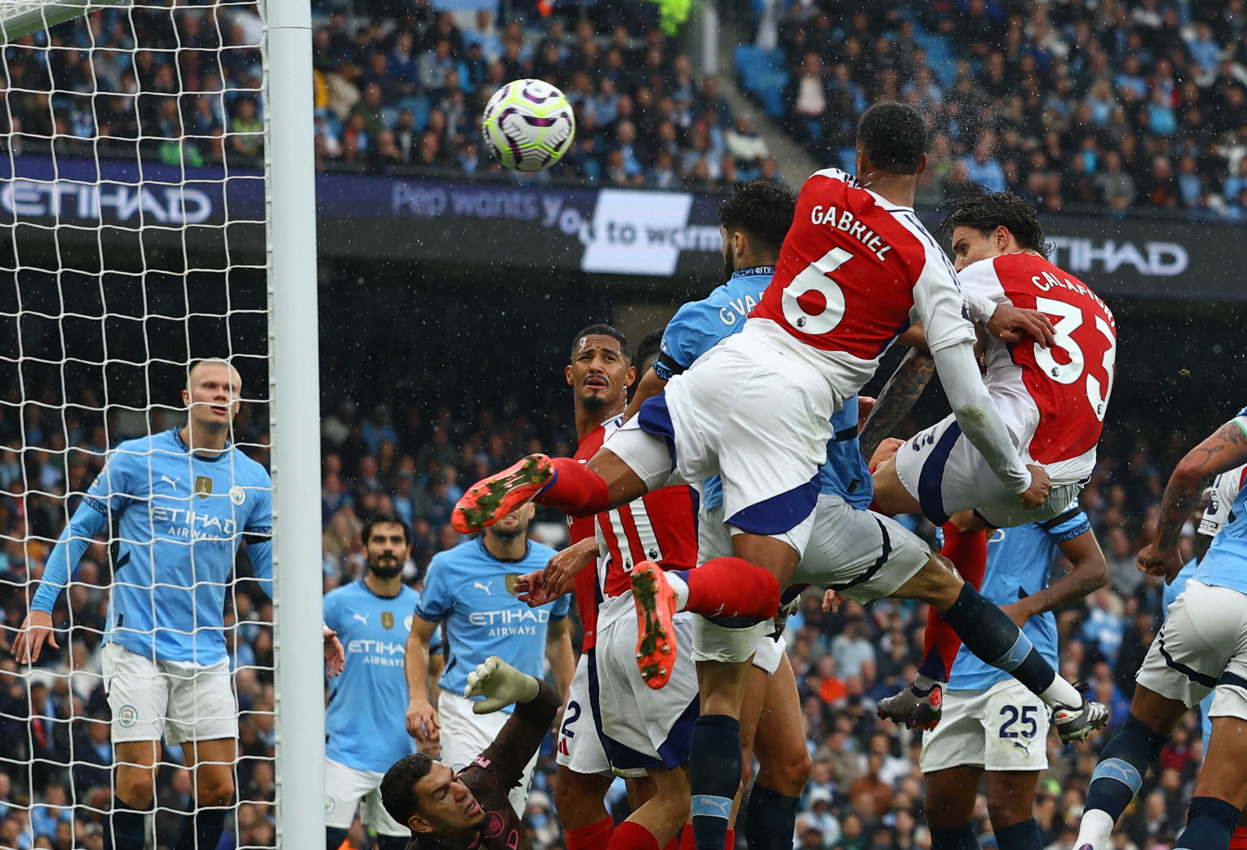 Soccer Football - Premier League - Manchester City v Arsenal - Etihad Stadium, Manchester, Britain - September 22, 2024 Arsenal's Gabriel Magalhaes scores their second goal REUTERS