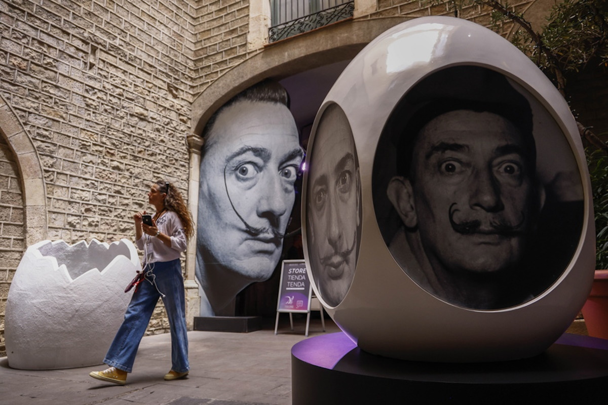 epa11405798 A visitor attends the preview of 'Dali Challenge', an immersive exhibition with innovative technology on the life and work of Spanish artist Salvador Dali (1904-1989), in Barcelona, Spain, 12 June 2024. The exhibition, which will run from June 13 to September 15, 2024, will feature an audio story in podcast format, more than 60 digitized works, virtual reality, augmented reality, micro-mapping and other technological elements.  EPA