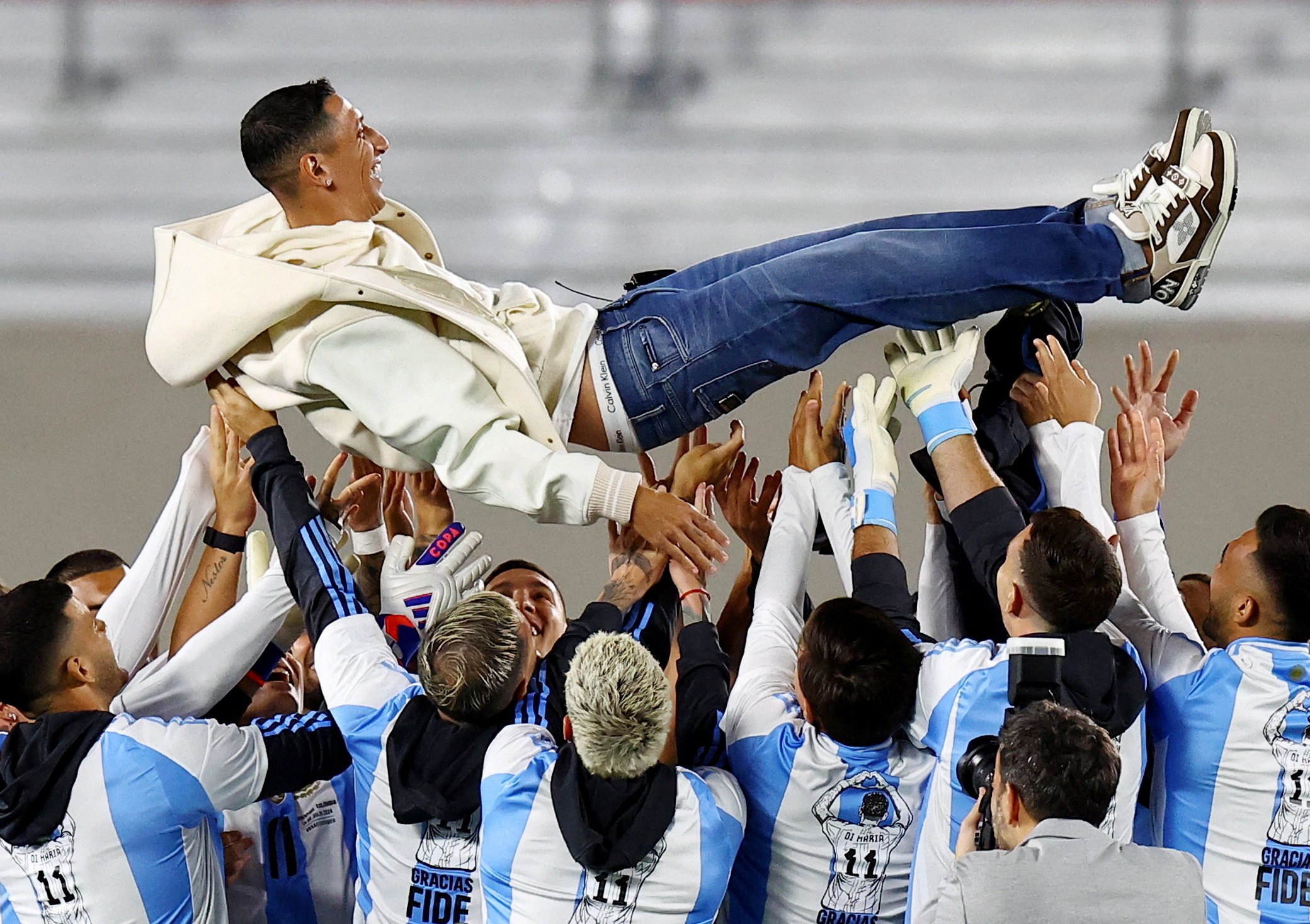 Soccer Football - World Cup - South American Qualifiers - Argentina v Chile - Estadio Mas Monumental, Buenos Aires, Argentina - September 5, 2024 Argentina's Angel Di Maria is tossed by teammates during his tribute before the match after he retires from the national team  REUTERS