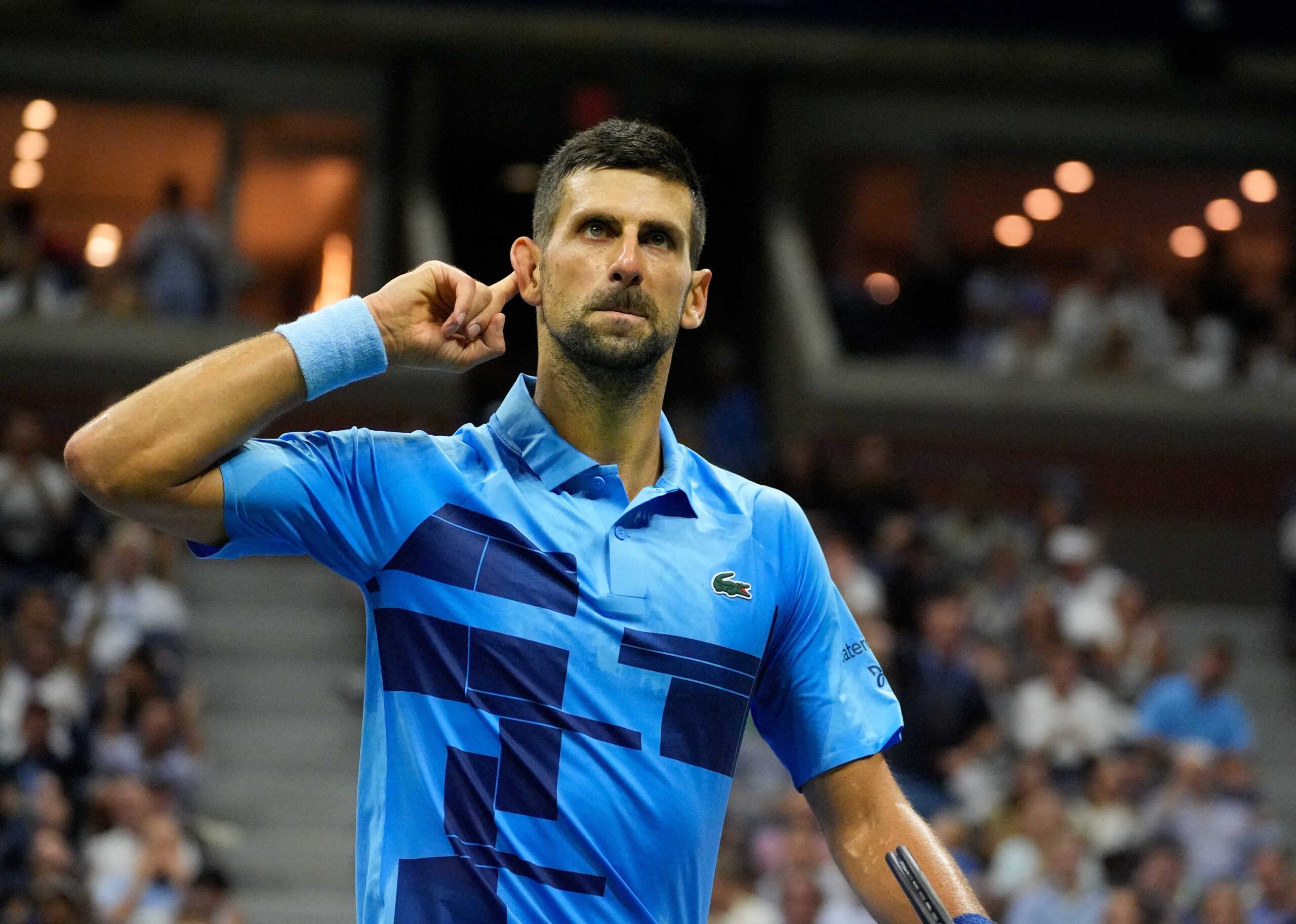 Aug 30, 2024; Flushing, NY, USA;  Novak Djokovic (SRB) works the crowd while playing Alexei Popyrin (AUS) on day five of the 2024 U.S. Open tennis tournament at USTA Billie Jean King National Tennis Center. Mandatory Credit: Robert Deutsch-USA TODAY Sports