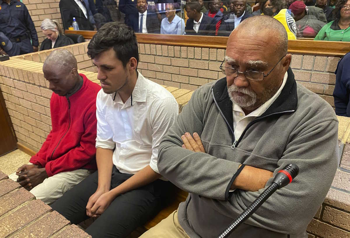 Three men accused of killing two women and feeding their bodies to pigs, from right to left, farm-owner, Zachariah Olivier, supervisor, Adrian Rudolph de Wet and employee, William Musora appear in court Polokwane, South Africa, Tuesday, Sept. 10, 2024. (AP Photo)