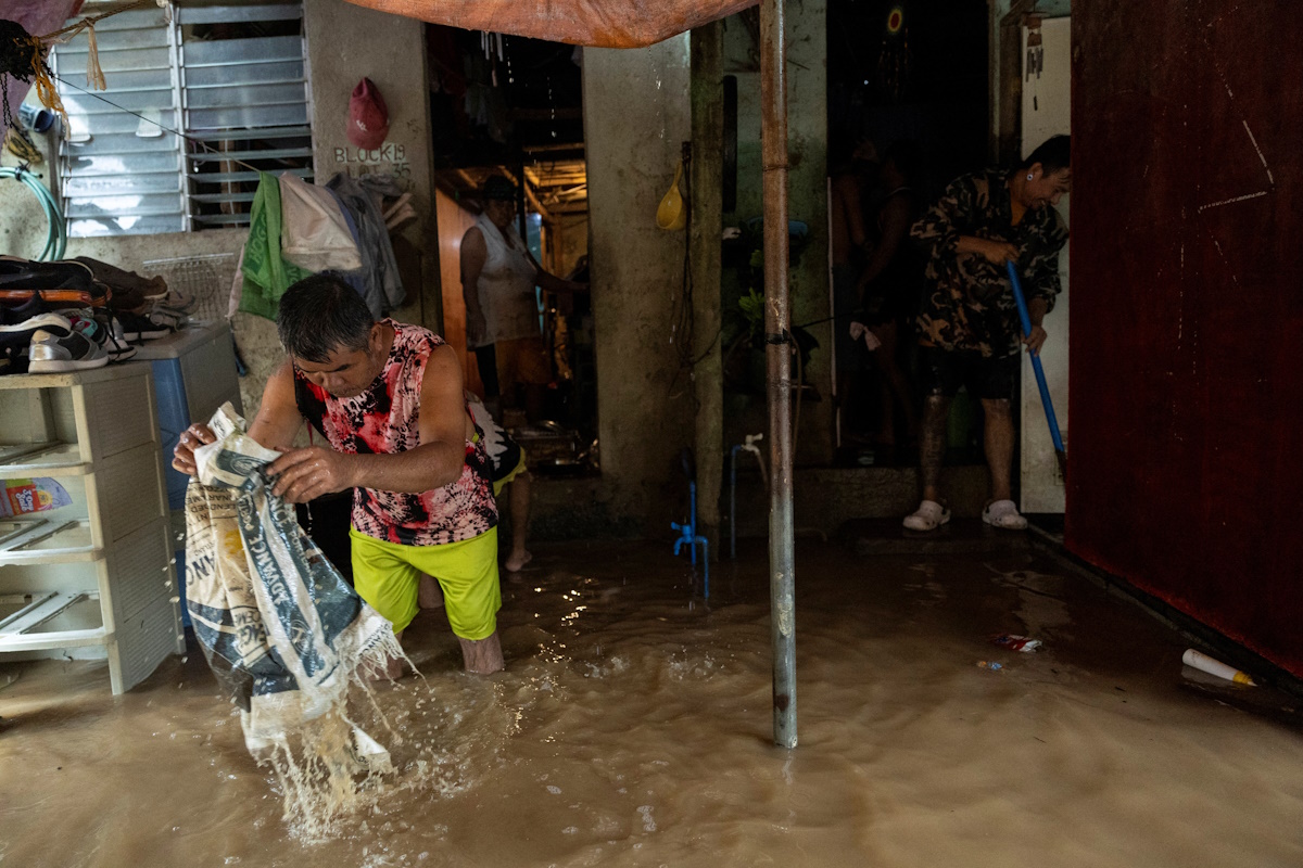 Residents clean their belongings, and the mud out of their homes, after flooding due to heavy rains brought by Tropical storm Yagi, locally known as Enteng, in Baras, Rizal province, Philippines, September 2, 2024. REUTERS