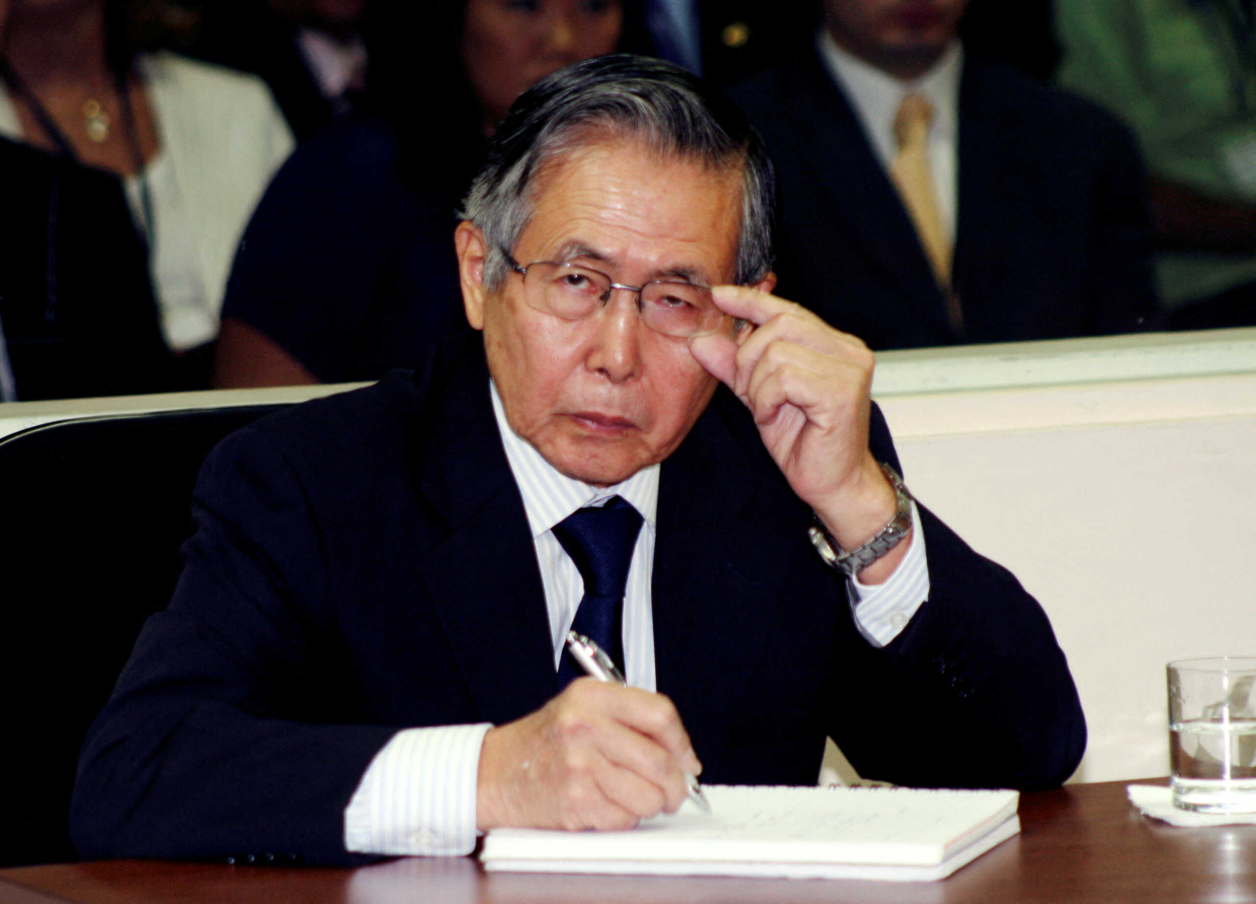 FILE PHOTO: Peru's former President Alberto Fujimori listens to the judge during the reading of the sentence of his trial at the special police headquarters in Lima, Peru, April 7, 2009.   Francisco Medina