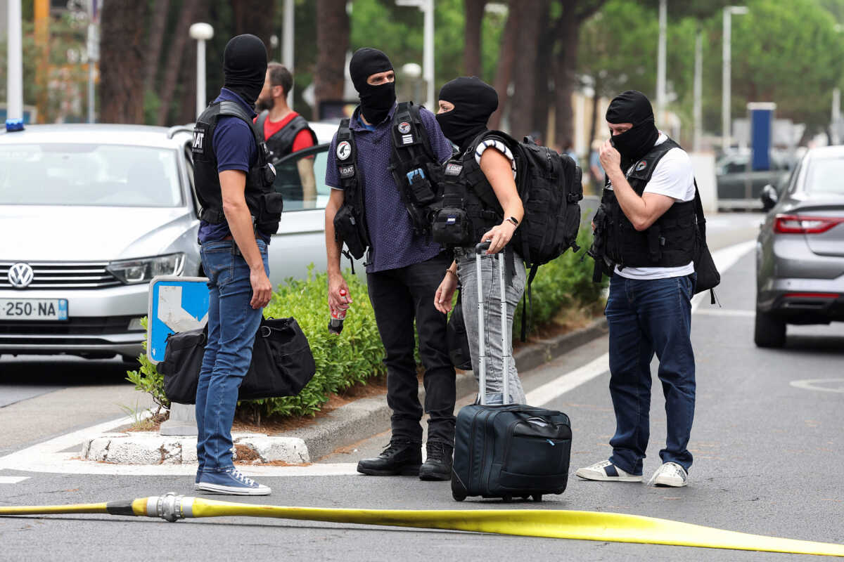 French anti-terror judiciary police investigators work near the city's synagogue, after cars were set on fire in front of the synagogue, in La Grande-Motte, France, August 24, 2024. REUTERS