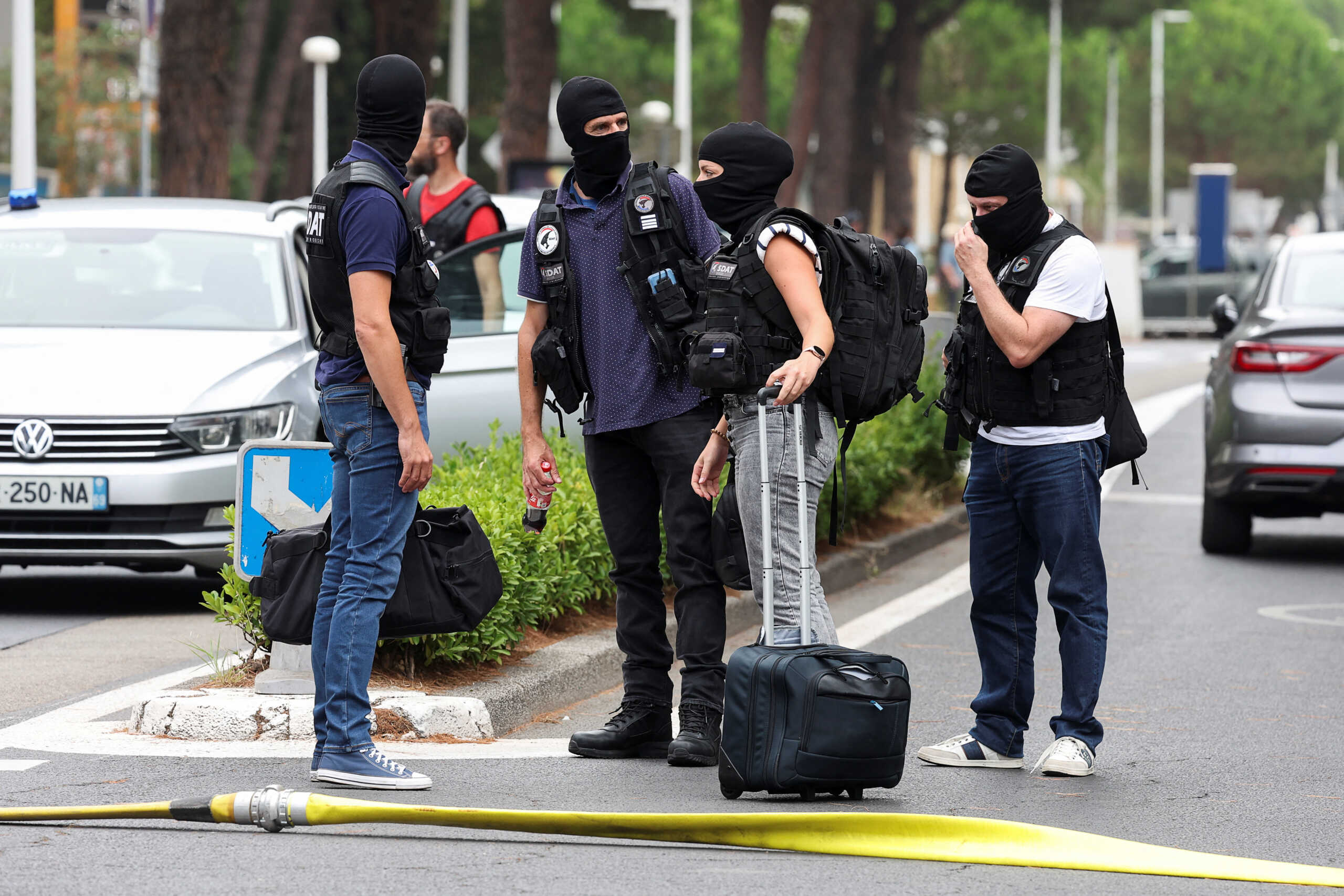 French anti-terror judiciary police investigators work near the city's synagogue, after cars were set on fire in front of the synagogue, in La Grande-Motte, France, August 24, 2024. REUTERS