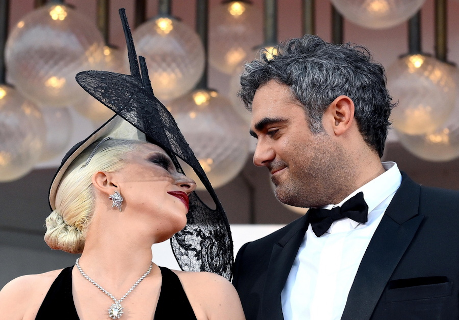 epa11584994 US singer and actor Lady Gaga (L) with Michael Polansky arrive for the premiere of 'Joker: Folie a Deux' at the 81st annual Venice International Film Festival, in Venice, Italy, 04 September 2024. The movie is presented in the official competition 'Venezia 81' at the festival running from 28 August to 07 September 2024.  EPA