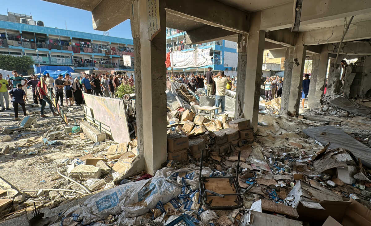 Palestinians inspect a school sheltering displaced people, after it was hit by an Israeli strike, amid the Israel-Hamas conflict, in Nuseirat in the central Gaza Strip, September 11, 2024. REUTERS