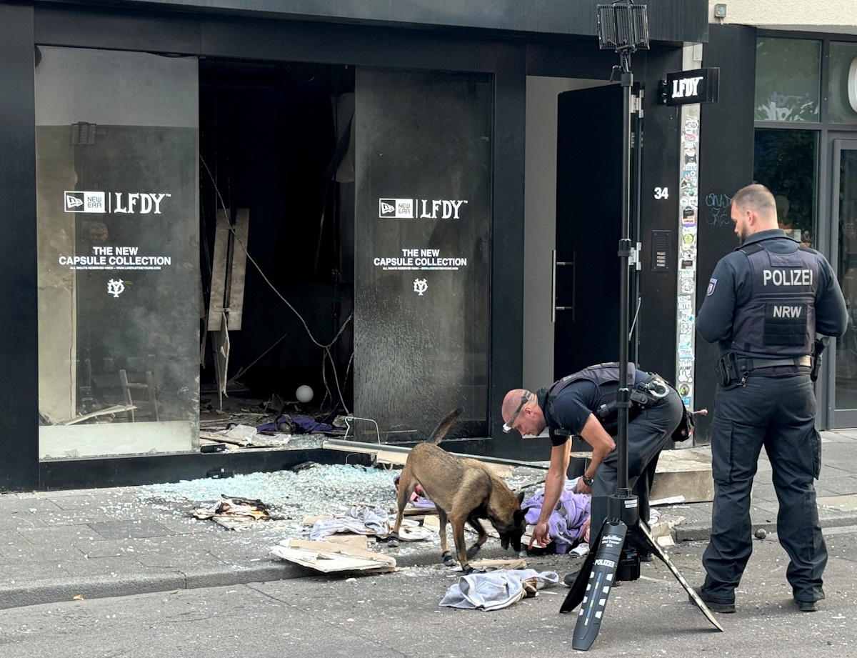Police works in front of a shop at Ehrenstrasse with a sniffer dog, following an explosion in central Cologne, Germany, September 18, 2024. Two days ago was already an explosion at the nearby Hohenzollernring.     REUTERS