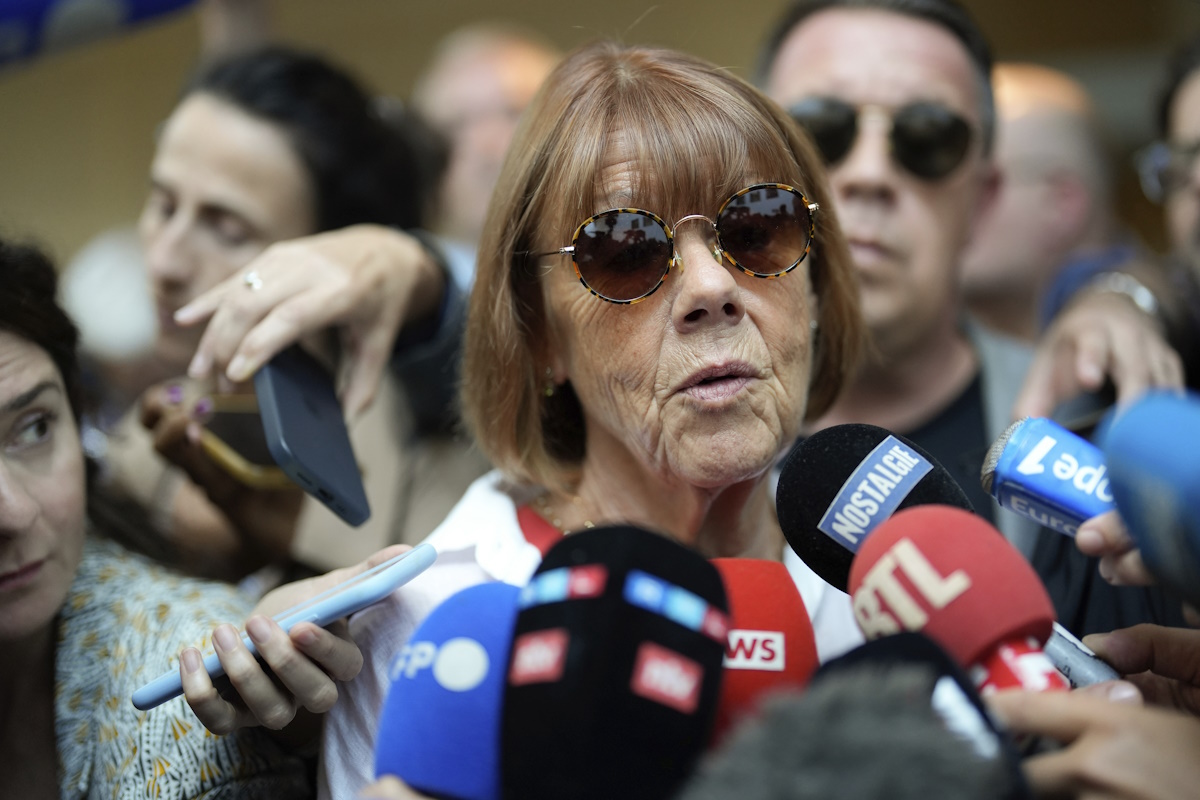Gisele Pelicot speaks to media as she leaves the Avignon court house, southern France, Thursday, Sept. 5, 2024. A woman allegedly drugged by her ex-husband so that she could be raped by other men while she laid unconscious, is expected to testify before a panel of French judges. (AP Photo