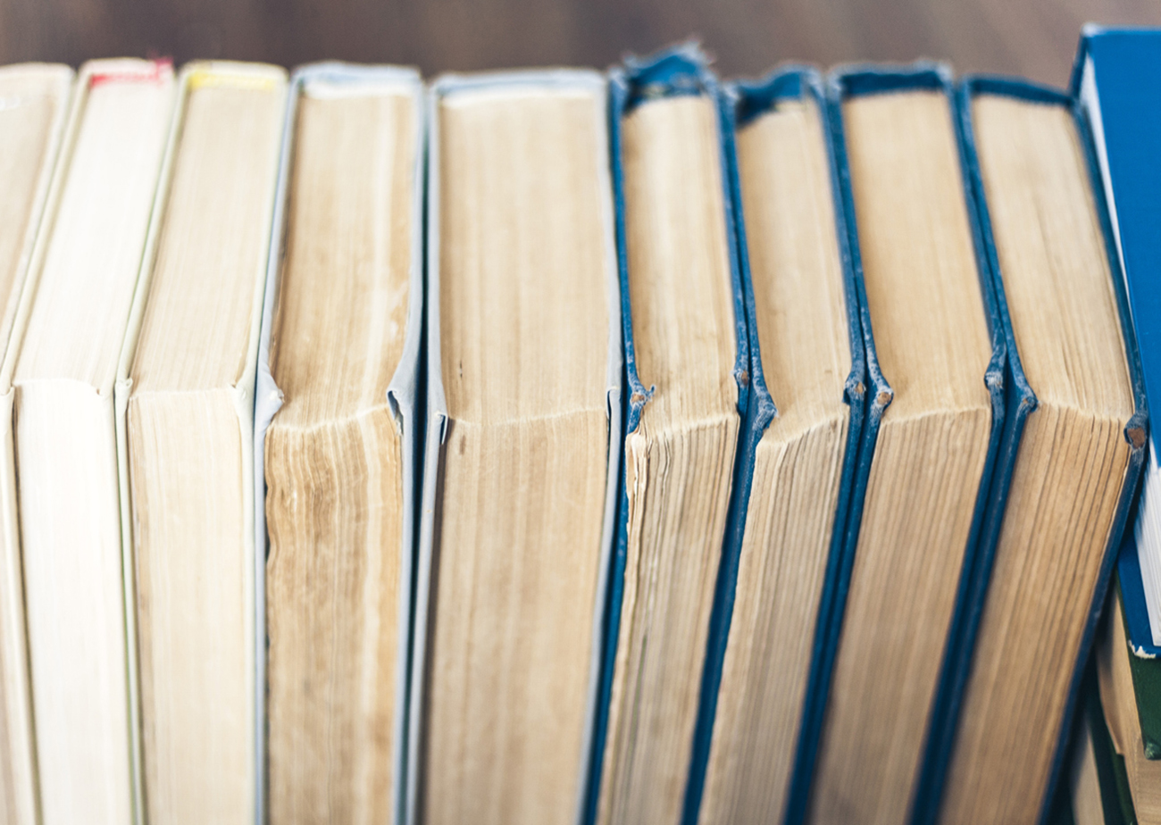 Stack of old book education concept background, many books piles with copy space for text
