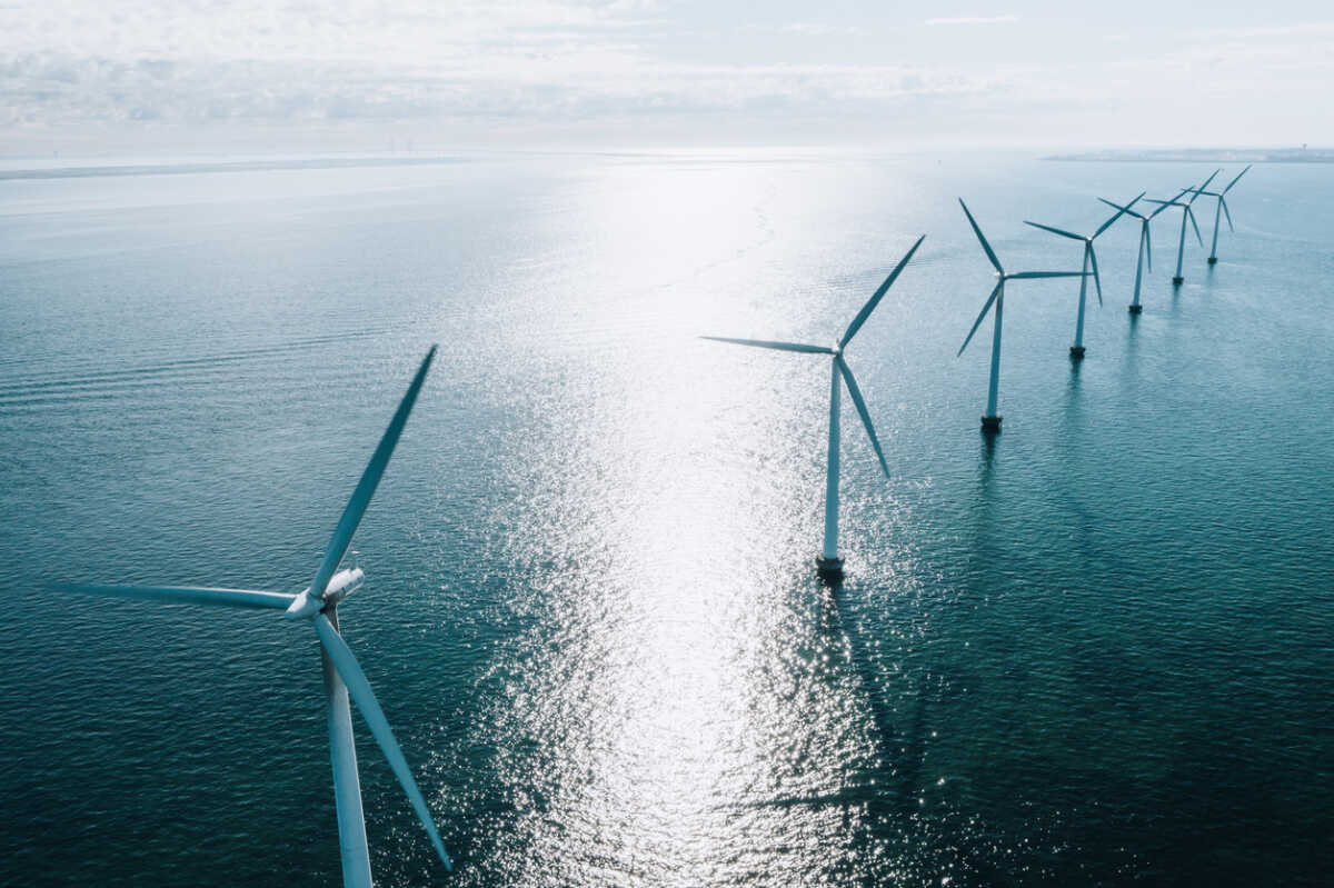 Coastal wind turbines at the oceanic windmill Middelgrunden, situated just outside Copenhagen. These iconic turbines, which can be seen from most places within this capital city, are a symbol of a future with green cities and sustainable energy in Denmark.
