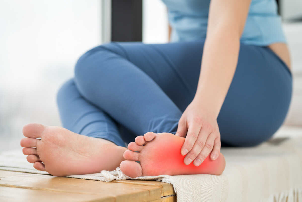 Joint diseases, hallux valgus, plantar fasciitis, heel spur, woman's leg hurts, pain in the foot, massage of female feet at home, health problems concept
