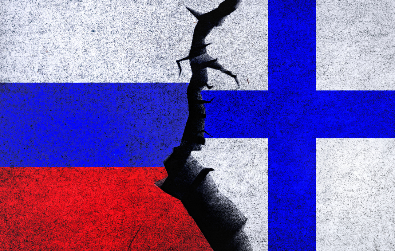 Russia vs Finland concept flags on a cracked wall. Finland and Russia political conflict, war crisis, economy relationship, trade concept
