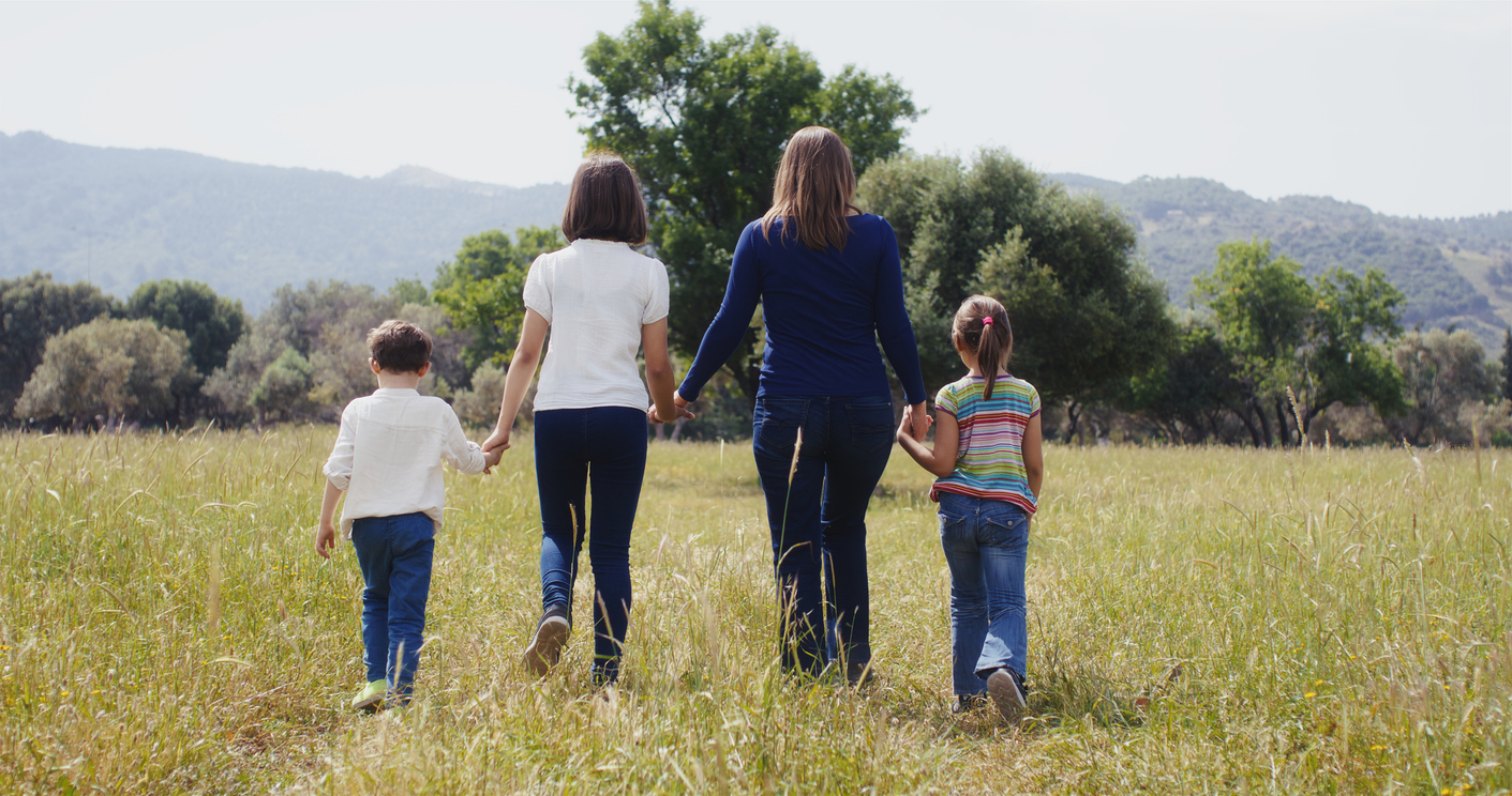 Family walking outdoors in summer