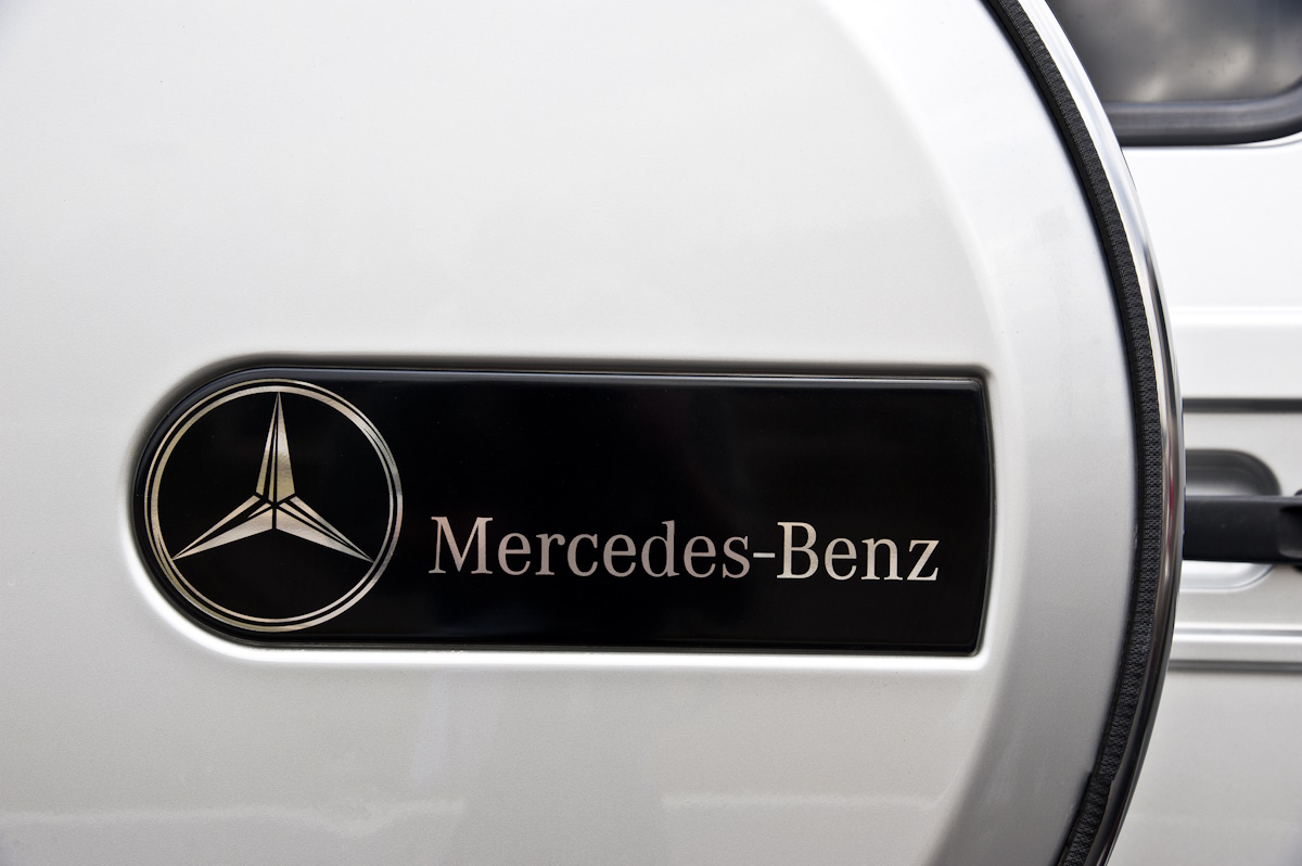 Knoxville, Tennessee, USA - February 20, 2011: The Mercedes-Benz name and logo are prominently featured on the rear-mounted spare tire carrier of a G-class Mercedes SUV.  The boxy, upright G-class vehicles are highly regarded for their "go-anywhere" abilities and ruggedness.
