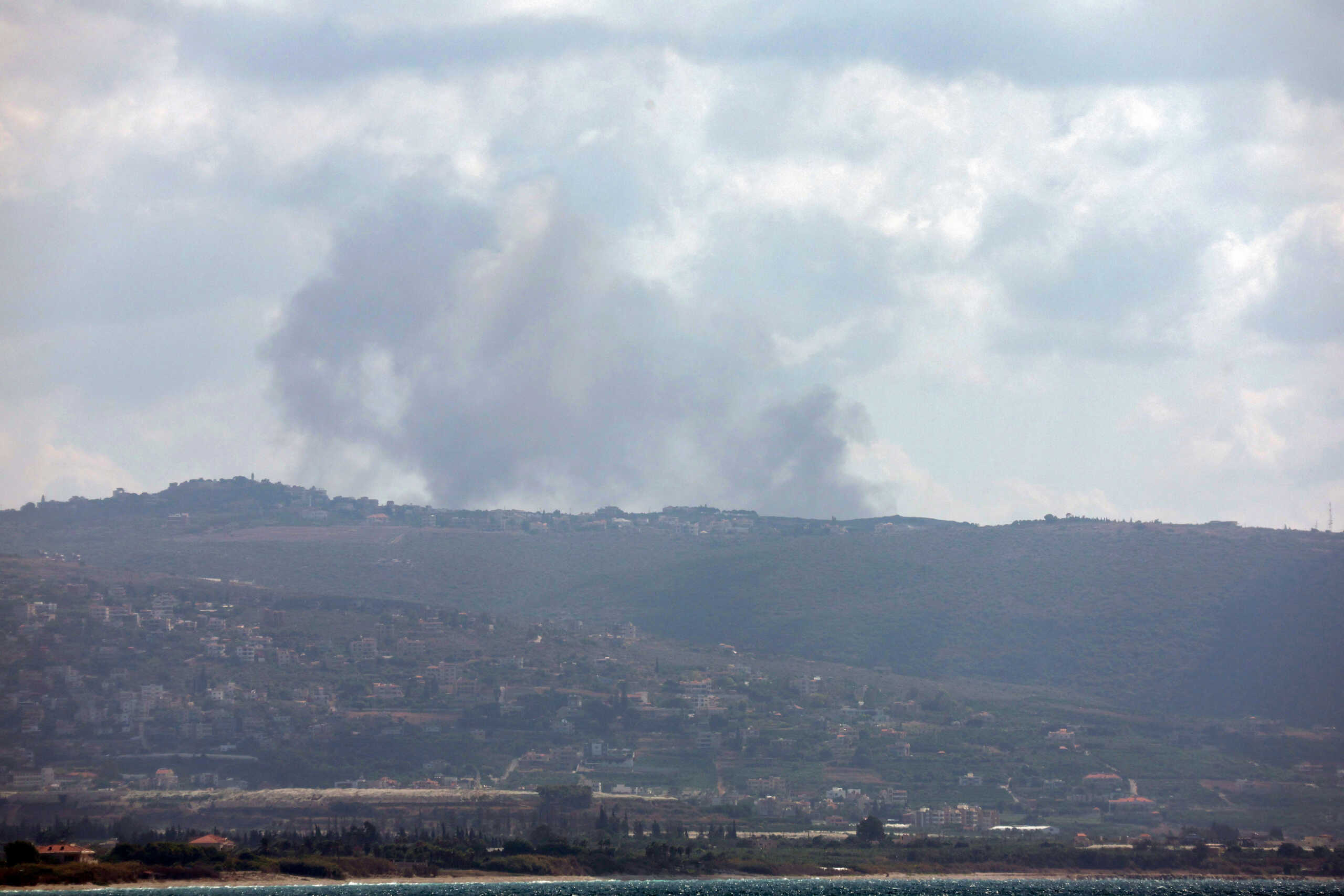 A view shows smoke rising on the Lebanese side of the border with Israel, amid ongoing cross-border hostilities between Hezbollah and Israeli forces, as seen from Tyre, southern Lebanon September 21, 2024 REUTERS