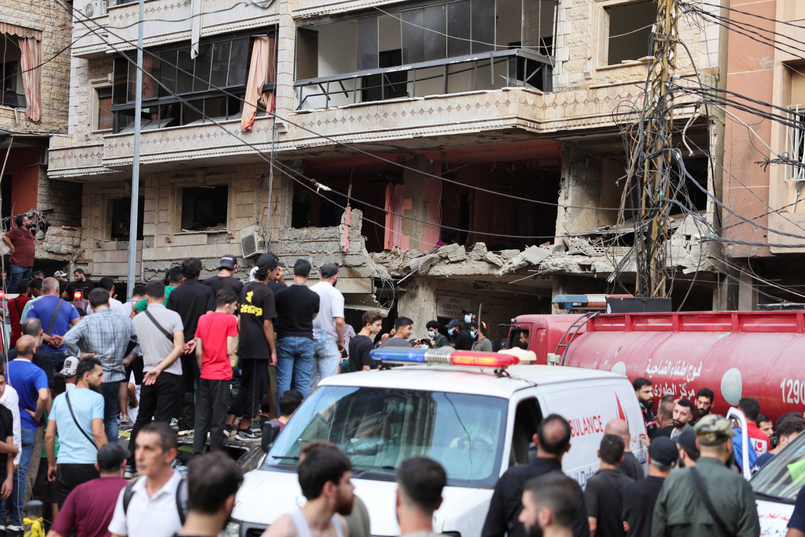 People inspect the site of an Israeli strike in the southern suburbs of Beirut, Lebanon, September 20, 2024. REUTERS