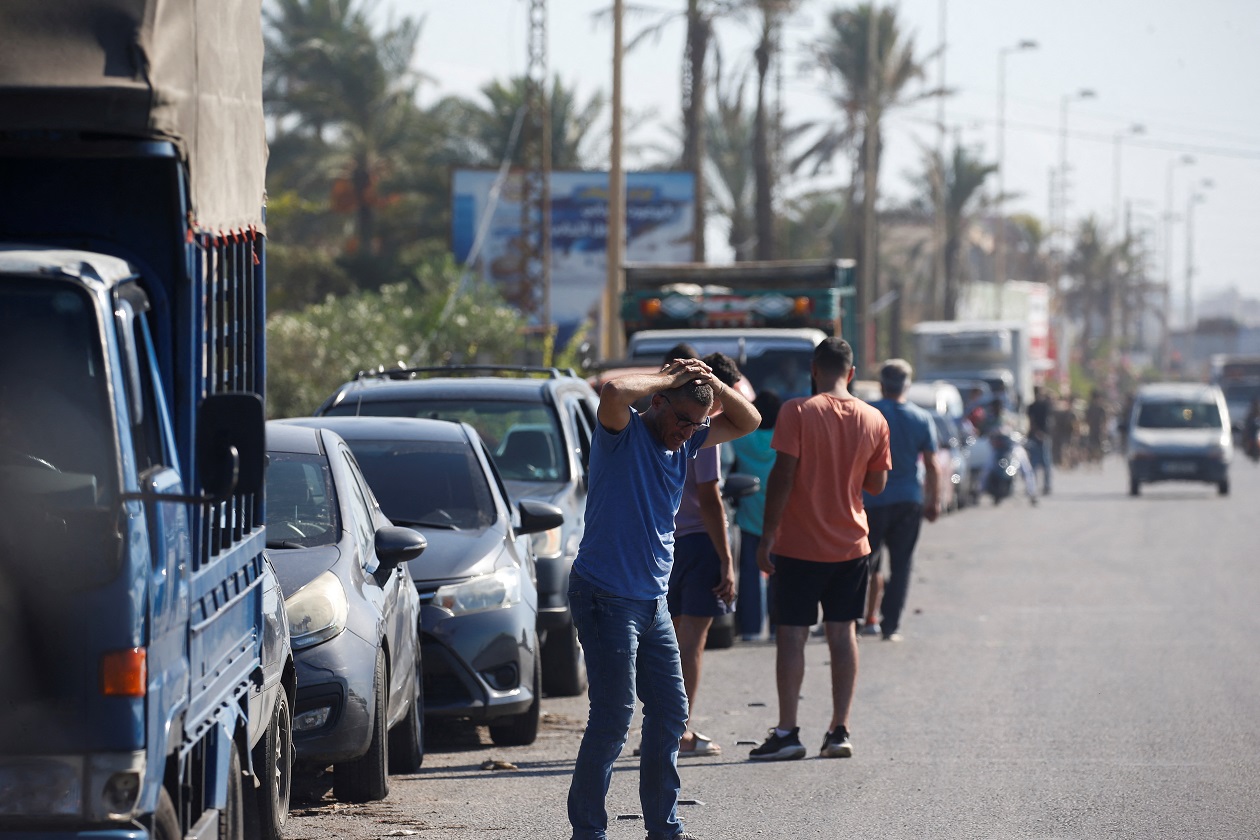 A man reacts as people in heavy traffic drive north from Lebanon's southern coastal city Sidon as some of them flee Israeli bombardment, amid ongoing cross-border hostilities between Hezbollah and Israeli forces, in Lebanon September 23, 2024 REUTERS