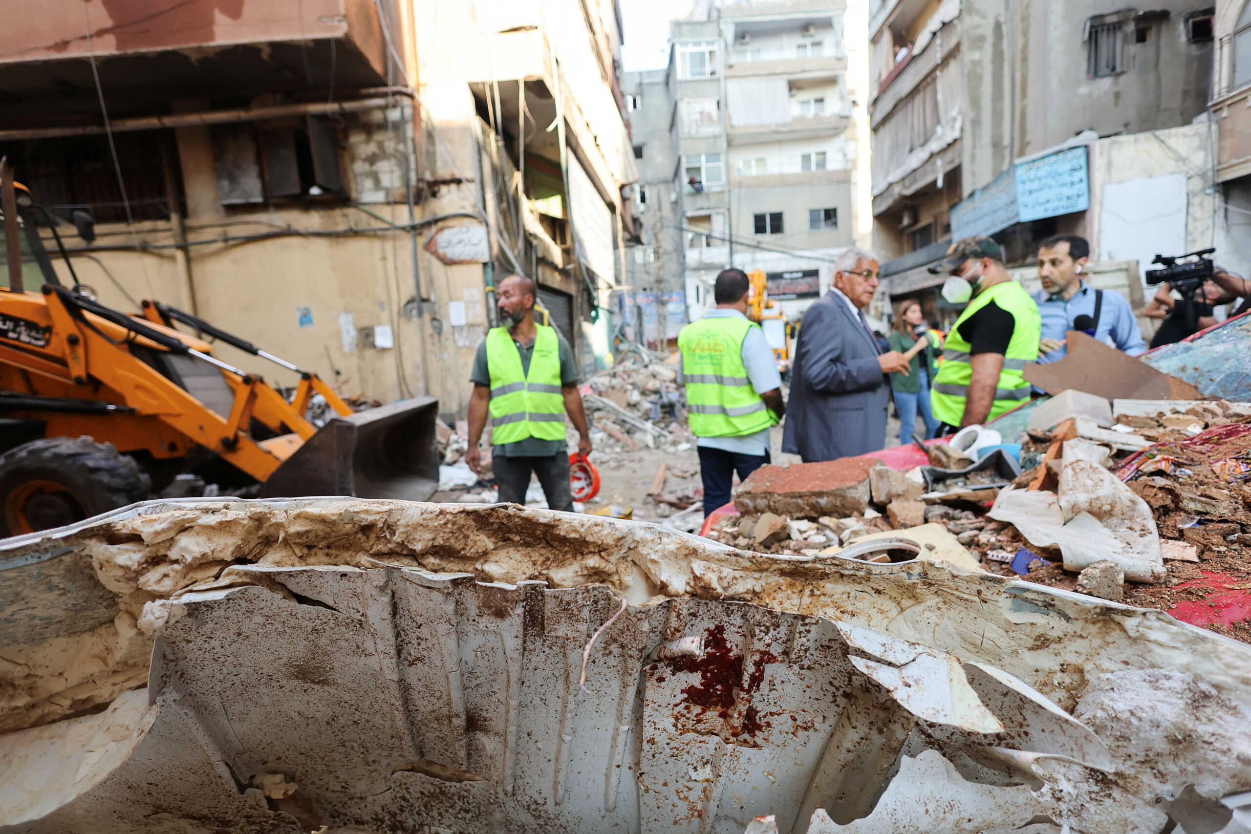 A view of a piece of debris, as people inspect the damage at the site of an Israeli strike in Beirut's southern suburbs, Lebanon September 24, 2024. REUTERS