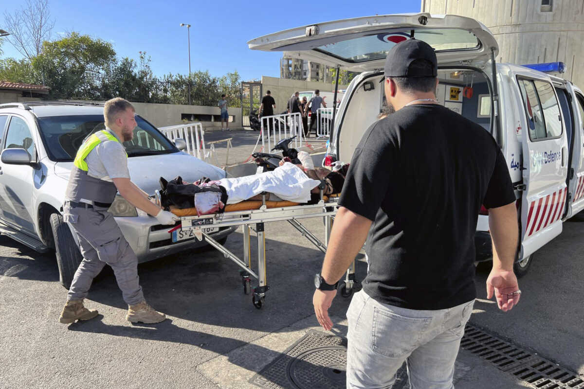 Civil Defense first-responders carry a wounded man whose handheld pager exploded at al-Zahraa hospital in Beirut, Lebanon, Tuesday, Sept. 17, 2024. (AP Photo