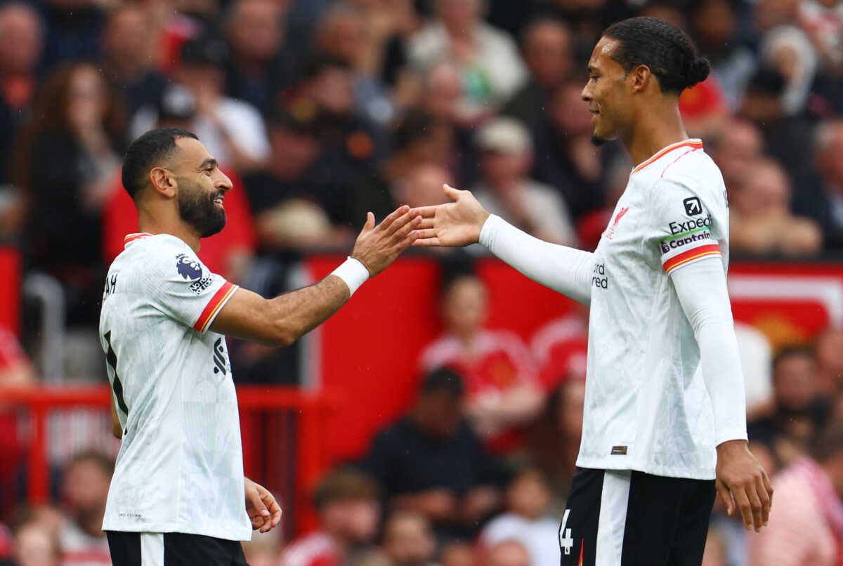 Soccer Football - Premier League - Manchester United v Liverpool - Old Trafford, Manchester, Britain - September 1, 2024 Liverpool's Mohamed Salah celebrates scoring their third goal with Virgil van Dijk REUTERS