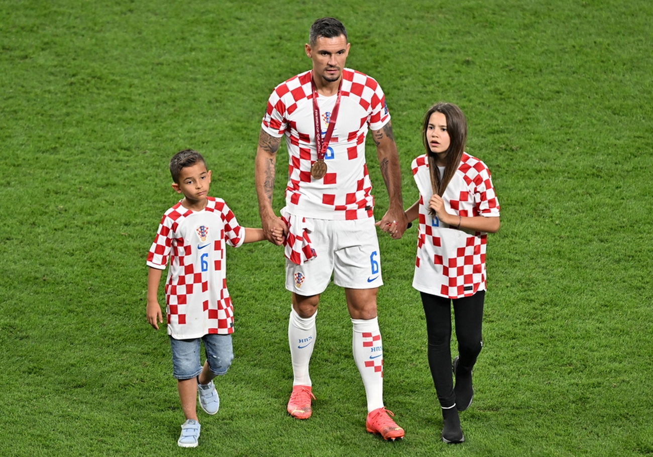 epa10370605 Dejan Lovren of Croatia (C) reacts with his children after the FIFA World Cup 2022 third place soccer match between Croatia and Morocco at Khalifa International Stadium in Doha, Qatar, 17 December 2022.  EPA