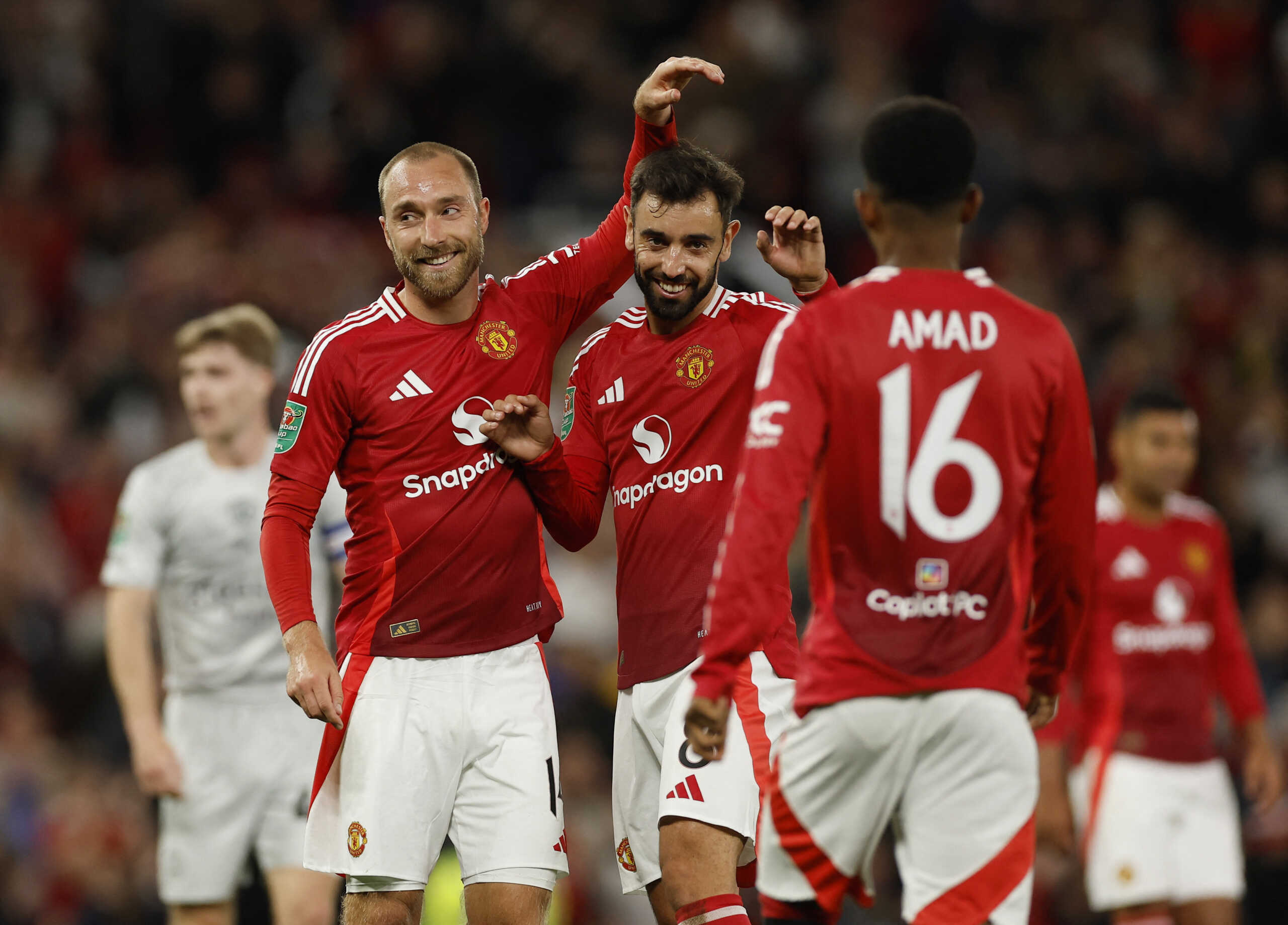 Soccer Football - Carabao Cup - Third Round - Manchester United v Barnsley - Old Trafford, Manchester, Britain - September 17, 2024 Manchester United's Christian Eriksen celebrates scoring their seventh goal with Bruno Fernandes Action Images via Reuters