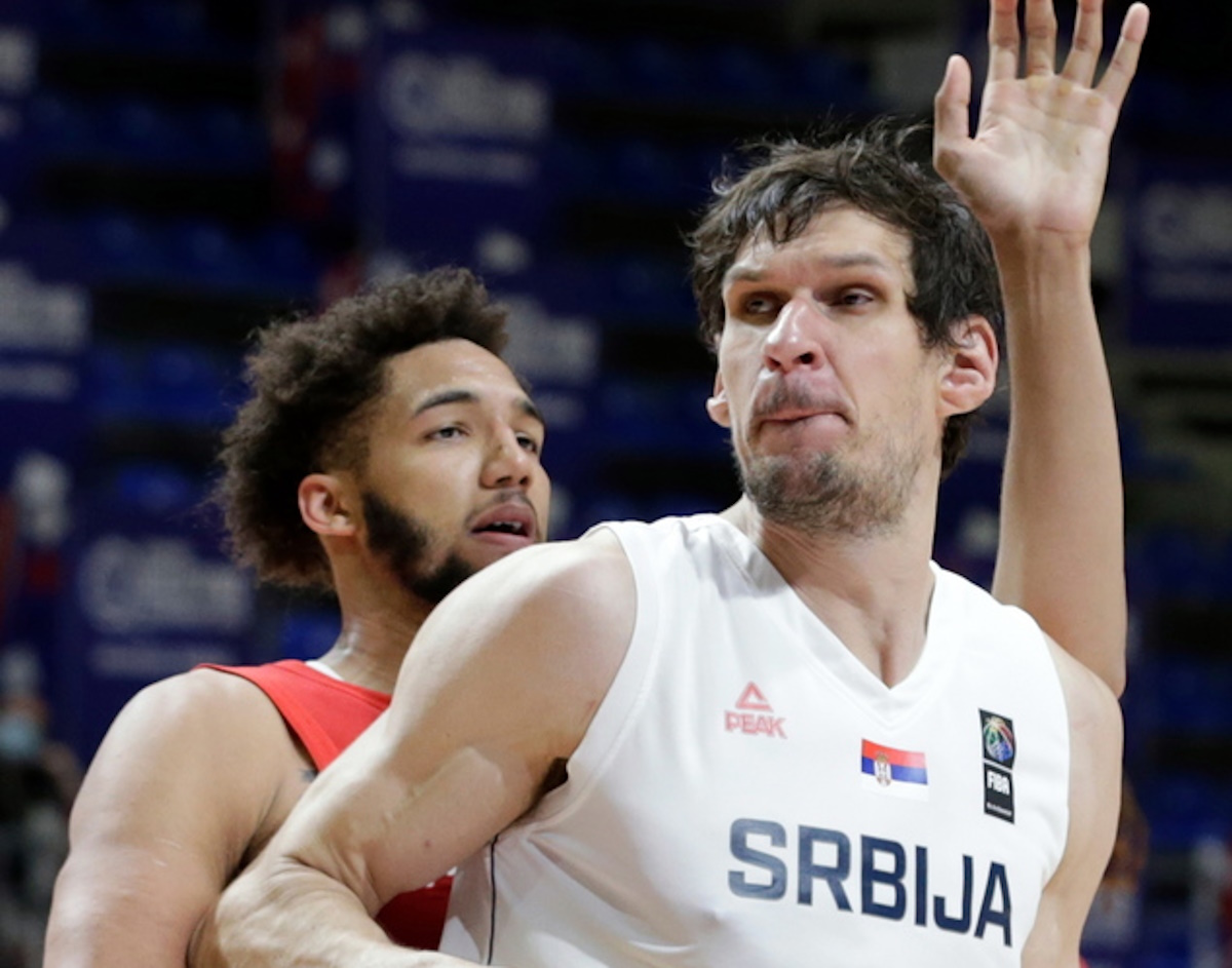 epa09320396 Serbia's Boban Marjanovic (R) in action against Puerto Rico's George Conditt (L) during the Men’s Olympic Qualifying Tournament game between Serbia and Puerto Rico in Belgrade, Serbia, 03 July 2021.  EPA