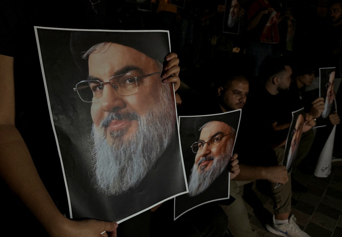 Supporters of Lebanon's Hezbollah leader Sayyed Hassan Nasrallah carry his pictures as they gather in Sidon, following his killing in an Israeli airstrike in Beirut's southern suburbs on Friday, Lebanon September 28, 2024. REUTERS