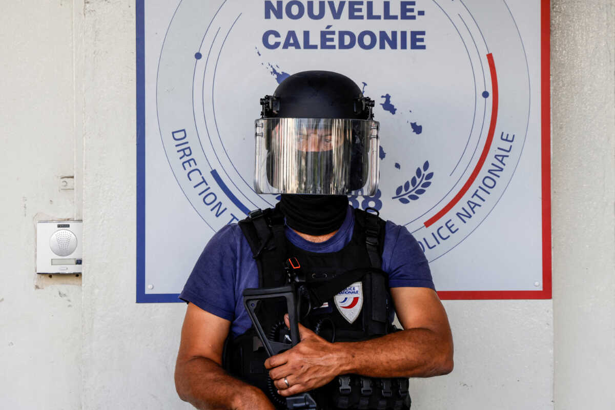 FILE PHOTO: A policeman waits for the arrival of French President Emmanuel Macron at the central police station in Noumea, France's Pacific territory of New Caledonia on May 23, 2024. LUDOVIC MARIN