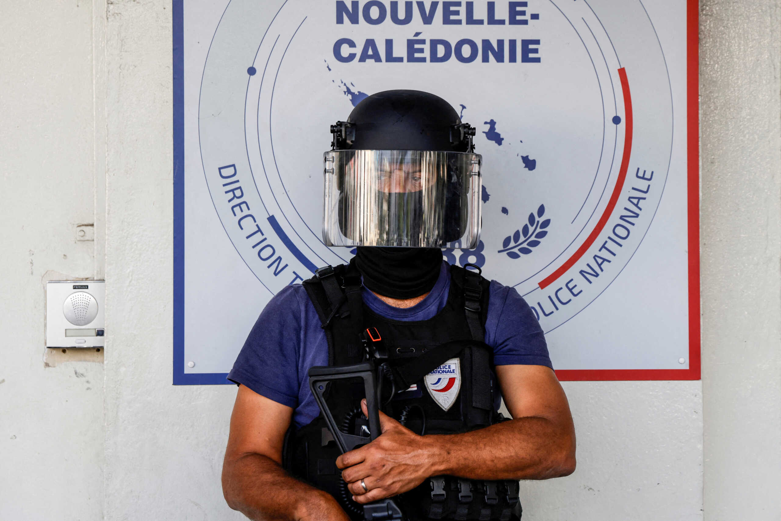 FILE PHOTO: A policeman waits for the arrival of French President Emmanuel Macron at the central police station in Noumea, France's Pacific territory of New Caledonia on May 23, 2024. LUDOVIC MARIN