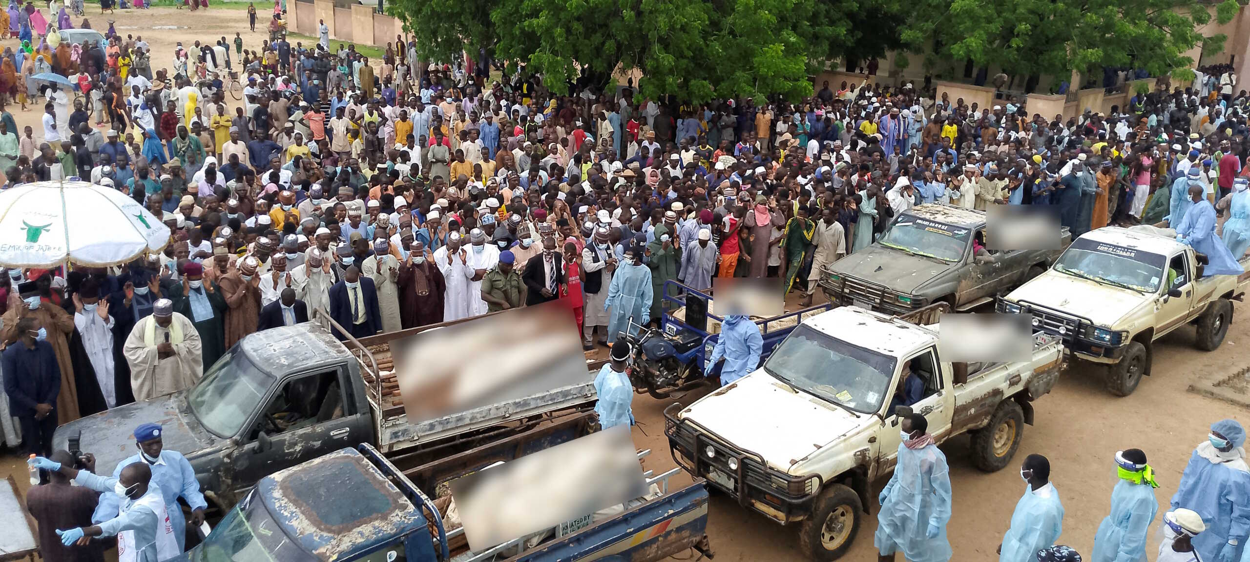 Trucks carry the wrapped bodies of people killed by suspected Boko Haram militants, during their funeral in Yobe, Nigeria September 3, 2024. REUTERS
