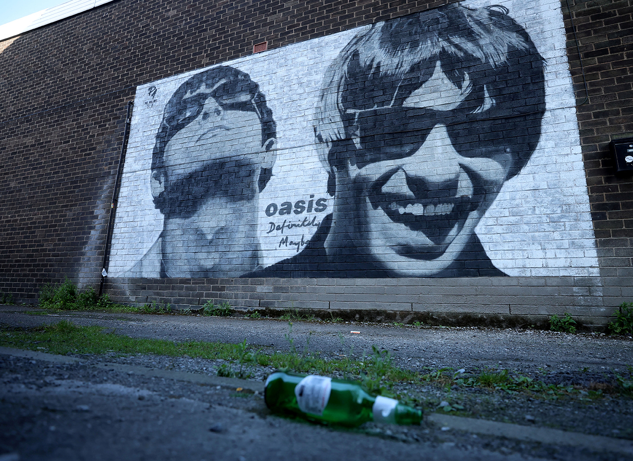 A view of a mural of Oasis band members Liam and Noel Gallagher by artist Pic.One.Art on the side of Sifters record shop in the Burnage area of Manchester, Britain, August 31, 2024. REUTERS