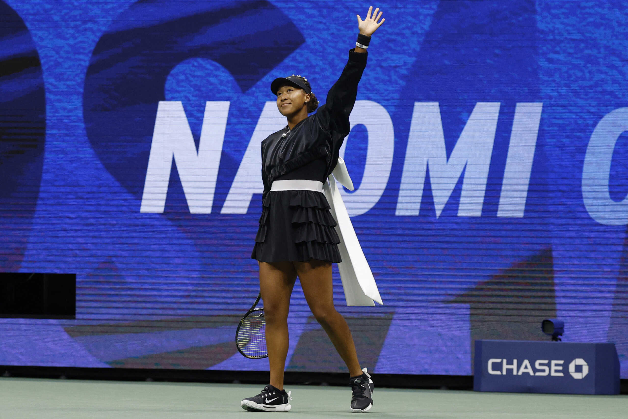 Aug 29, 2024; Flushing, NY, USA; Naomi Osaka (JPN) waves to the crowd during warmup prior to her match against Karolina Muchova (CZE)(not pictured) in a women's singles match on day four of the 2024 U.S. Open tennis tournament at Billie Jean King National Tennis Center. Mandatory Credit: Geoff Burke-USA TODAY Sports
