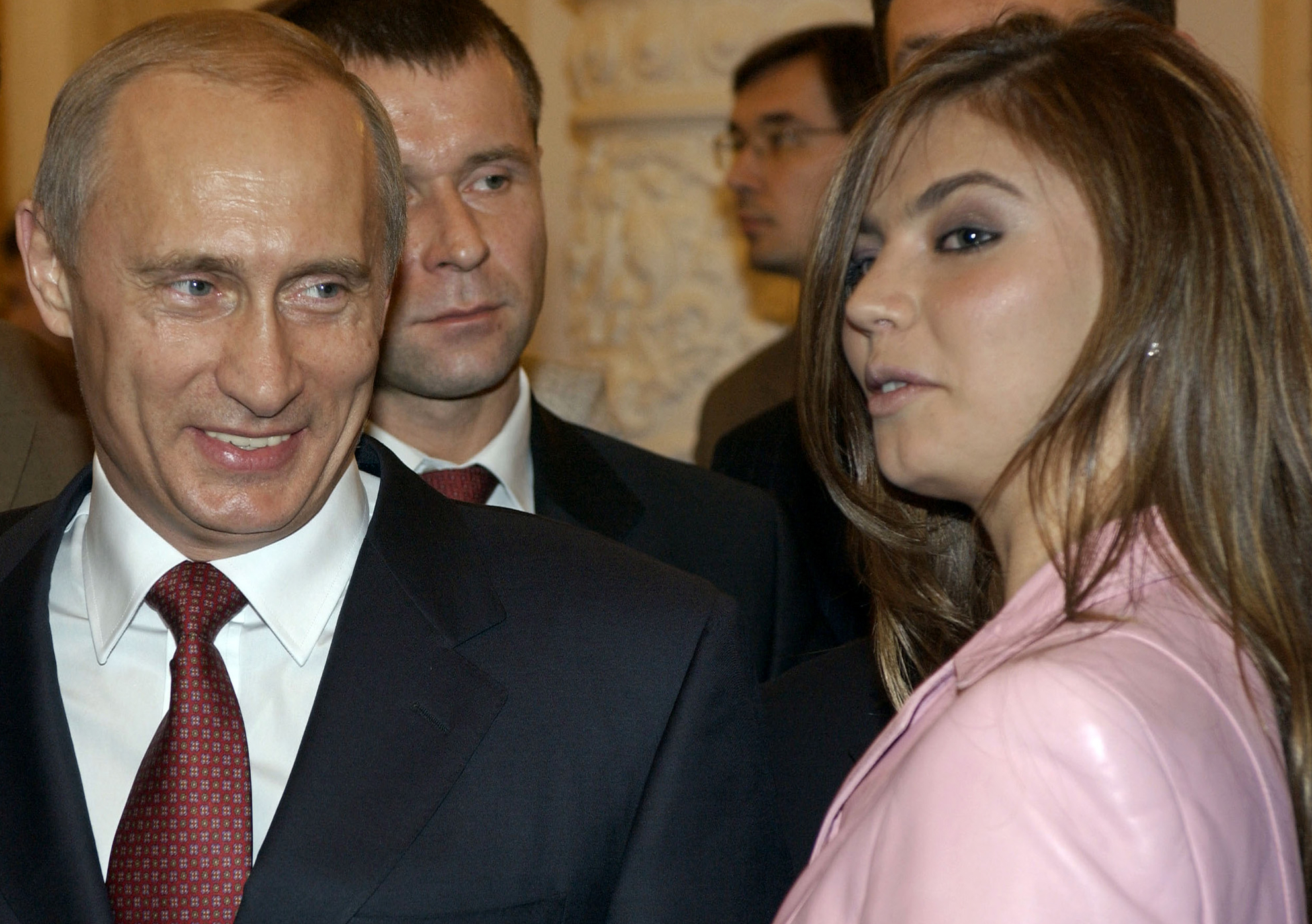 FILE - In this Thursday, Nov. 4, 2004 file photo President Vladimir Putin, left, speaks with gymnast Alina Kabaeva at a Kremlin banquet in Moscow, Russia. Alina Kabayeva, the Olympic gold gymnast whose relationship with Russian President Vladimir Putin is the subject of wide speculation, is resigning from her seat in the national parliament. Russian news reports say Kabayeva on Monday, Sept 15, 2014,  asked to step down in order to undertake other unspecified work. (AP Photo
