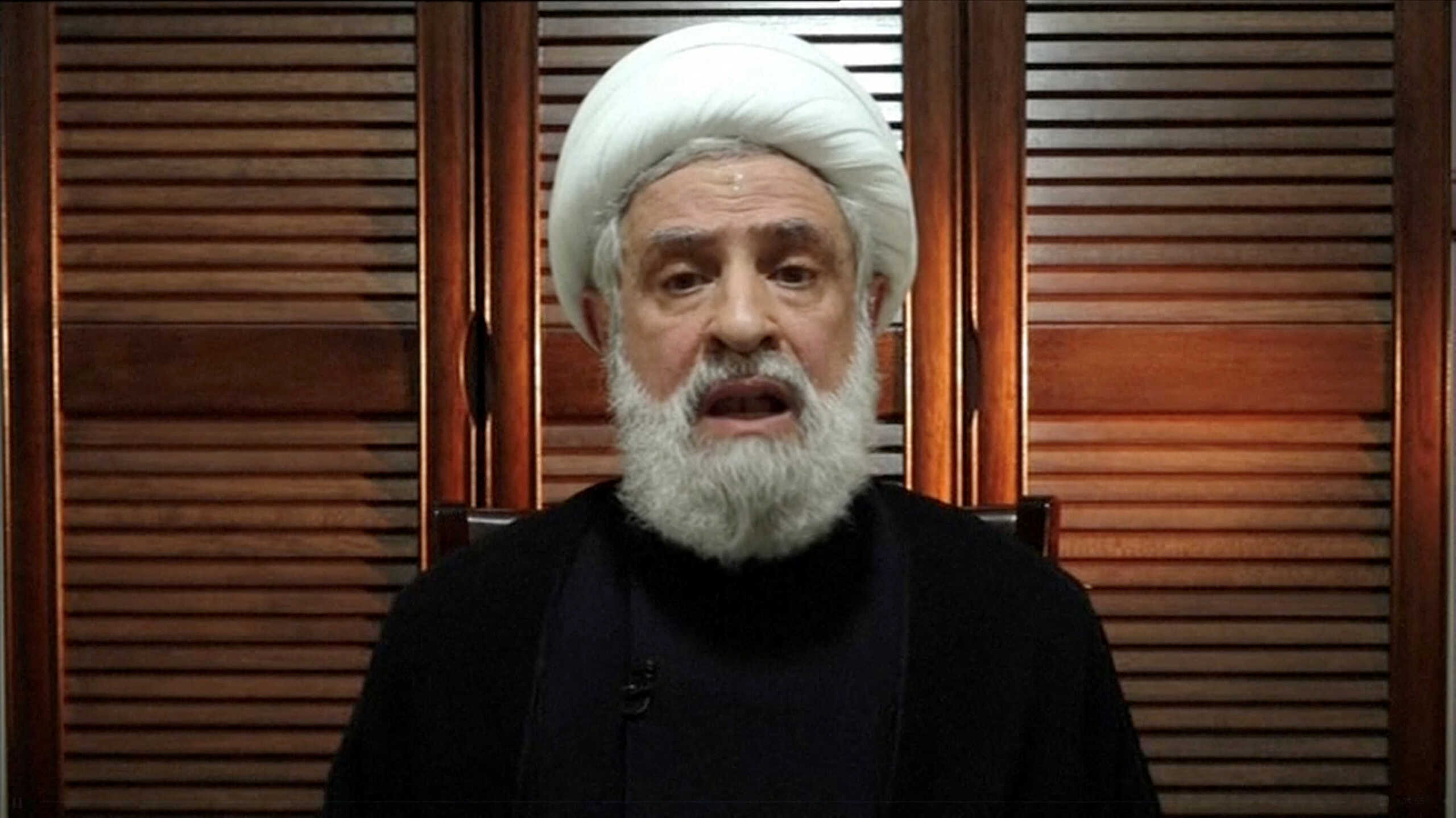 Lebanon's Hezbollah deputy leader Sheikh Naim Qassem delivers an address from an unknown location, days after Hezbollah chief Sayyed Hussein Hassan Nasrallah was killed in an Israeli airstrike, September 30, 2024 in this still image from video. Al Manar TV