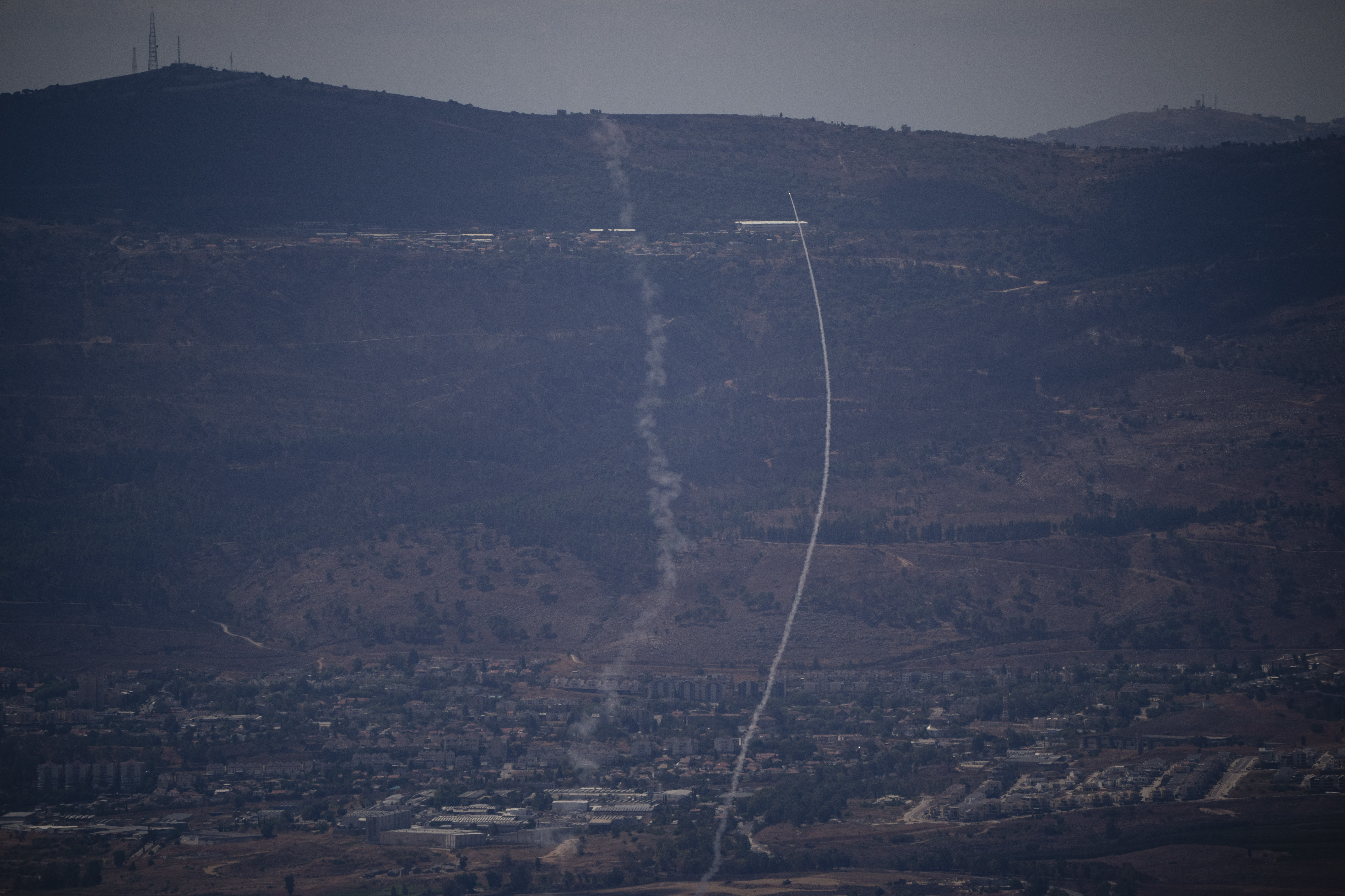 The Israeli Iron Dome air defense system fires to intercept an attack from Lebanon over the Galilee region, near Kiryat Shmona, as seen from the Israeli-annexed Golan Heights, Tuesday, Sept. 17, 2024. (AP Photo