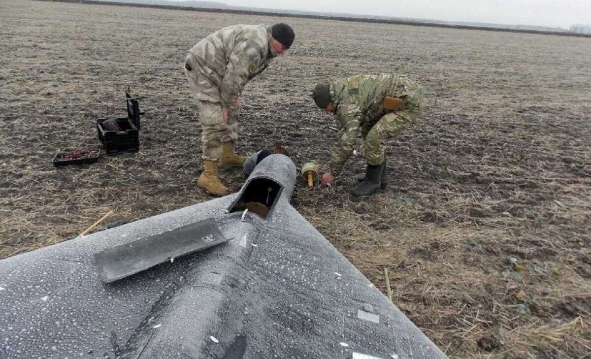 FILE PHOTO: Members of police demining unit remove a warhead from a Russian kamikaze unmanned aerial vehicle landed by a radio electronic warfare during one of latest drone strikes, amid Russia's attack on Ukraine, in an unknown location in Ukraine, in this handout picture released January 26, 2024.  Press service of the National Police of Ukraine
