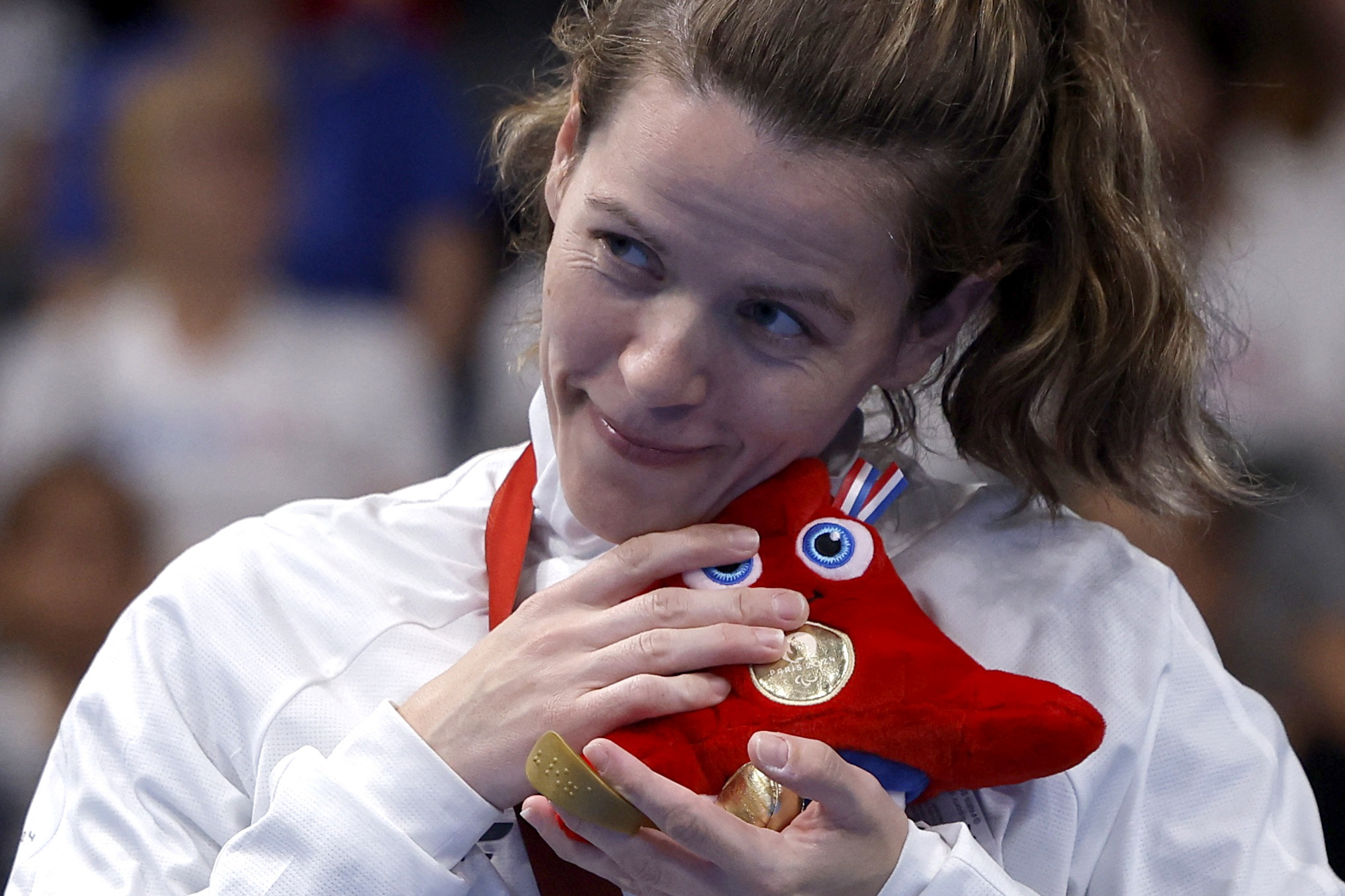 Paris 2024 Paralympics - Swimming - Women's 50m Backstroke - S4 Medal Ceremony - Paris La Defense Arena, Nanterre, France - September 7, 2024 Gold medallist Alexandra Stamatopoulou of Greece celebrates on the podium REUTERS