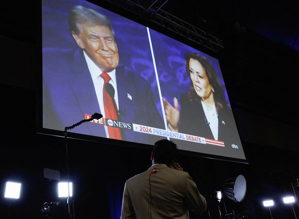 A screen displays the presidential debate hosted by ABC between Republican presidential nominee, former U.S. President Donald Trump and Democratic presidential nominee, U.S. Vice President Kamala Harris in Philadelphia, Pennsylvania, U.S., September 10, 2024. REUTERS