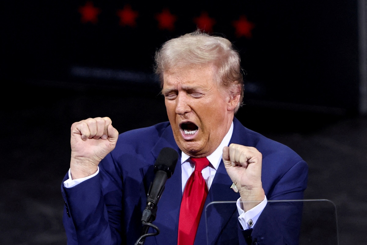 Republican presidential nominee and former U.S. President Donald Trump gestures while speaking during a campaign rally in Tucson, Arizona, U.S. September 12, 2024.  REUTERS