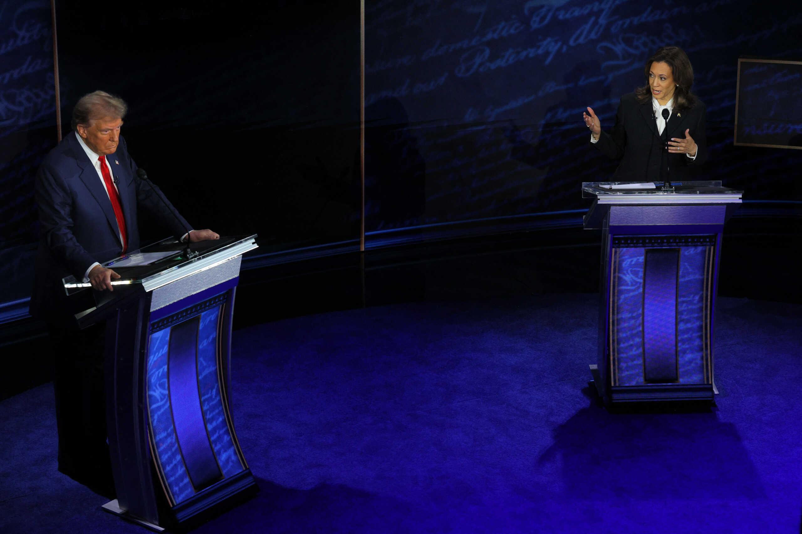 Democratic presidential nominee, U.S. Vice President Kamala Harris speaks during a presidential debate hosted by ABC as Republican presidential nominee, former U.S. President Donald Trump listens, in Philadelphia, Pennsylvania, U.S., September 10, 2024. REUTERS
