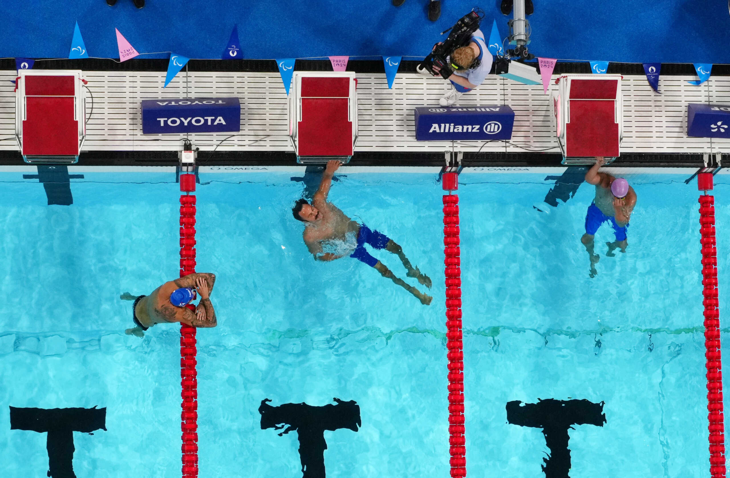 Paris 2024 Paralympics - Swimming - Men's 100m Breaststroke - SB4 Heats - Paris La Defense Arena, Nanterre, France - September 2, 2024 Antonios Tsapatakis of Greece reacts after finishing first between second placed Manuel Mateo Bortuzzo of Italy and third placed Muhammad Nur Syaiful Zulkafli of Malaysia REUTERS